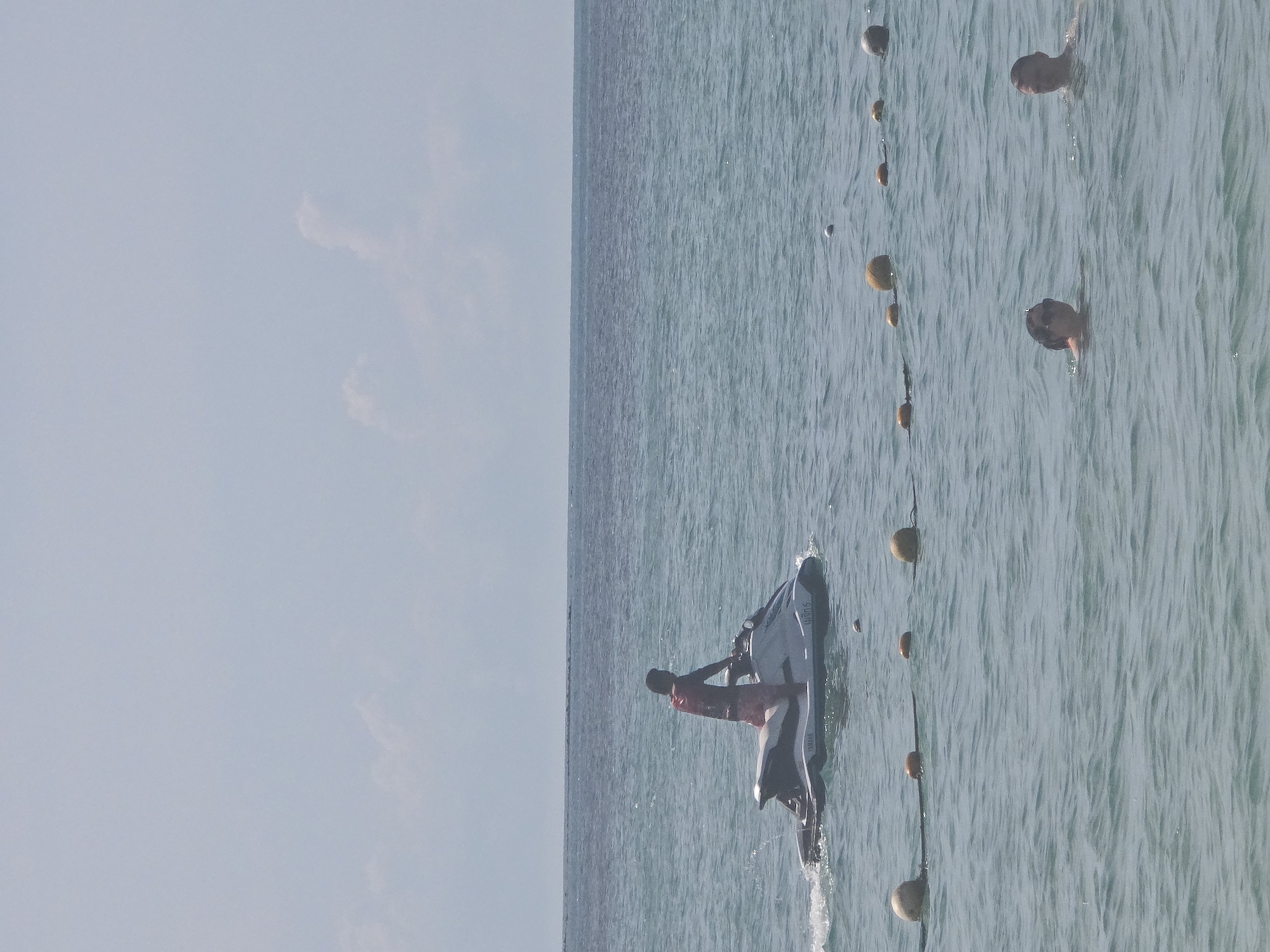 Lamai Beach in full swing: water toys, jet skis, and beachgoers