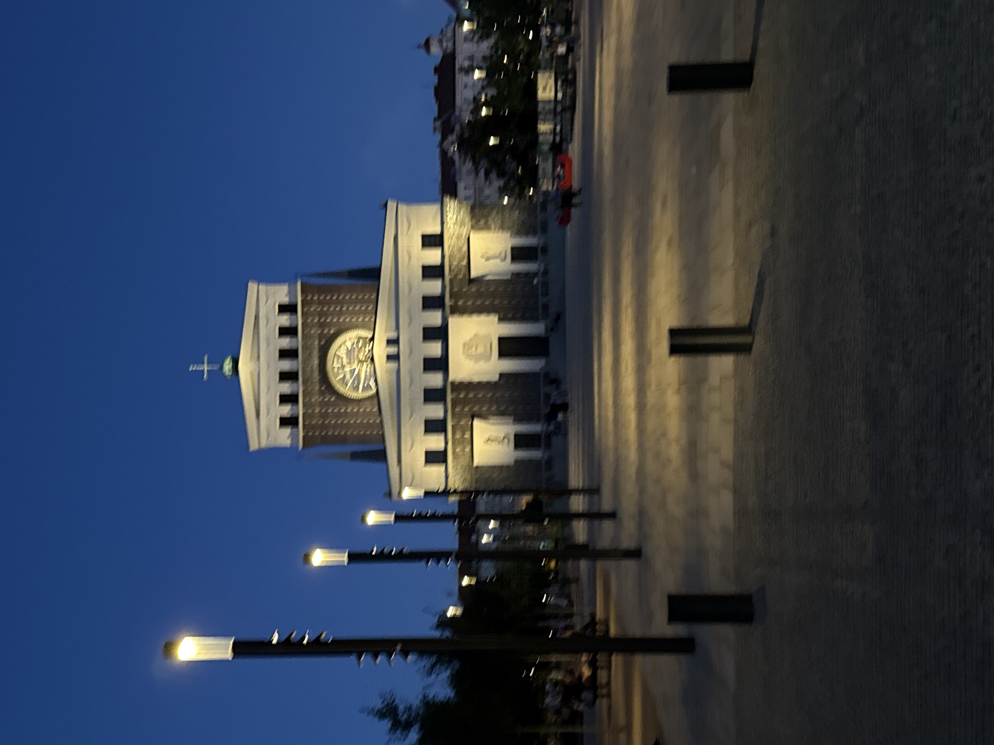 Prague's Vinohrady church lit up at dusk