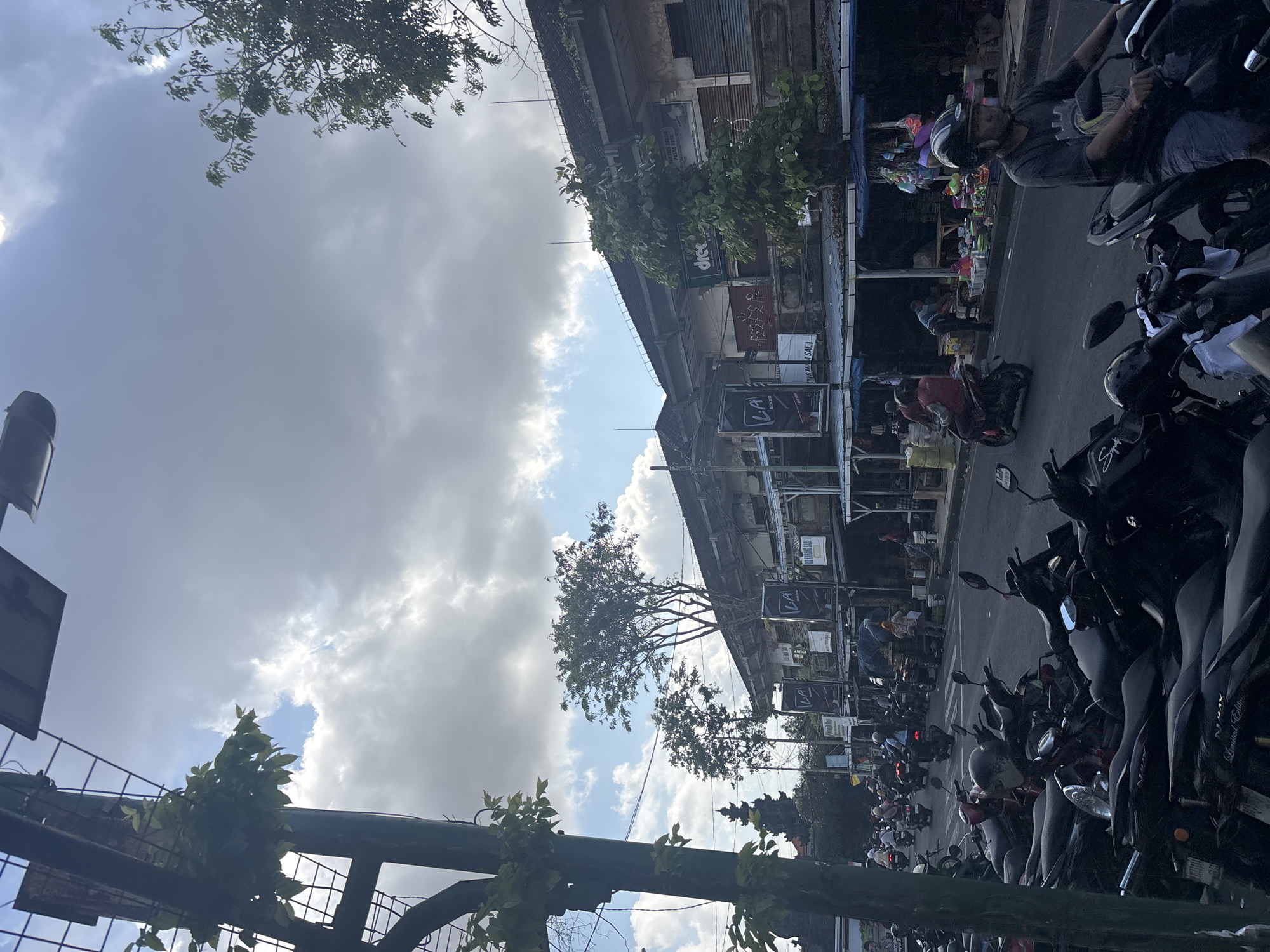 Street traffic and a fuel queue in Kuta, Bali