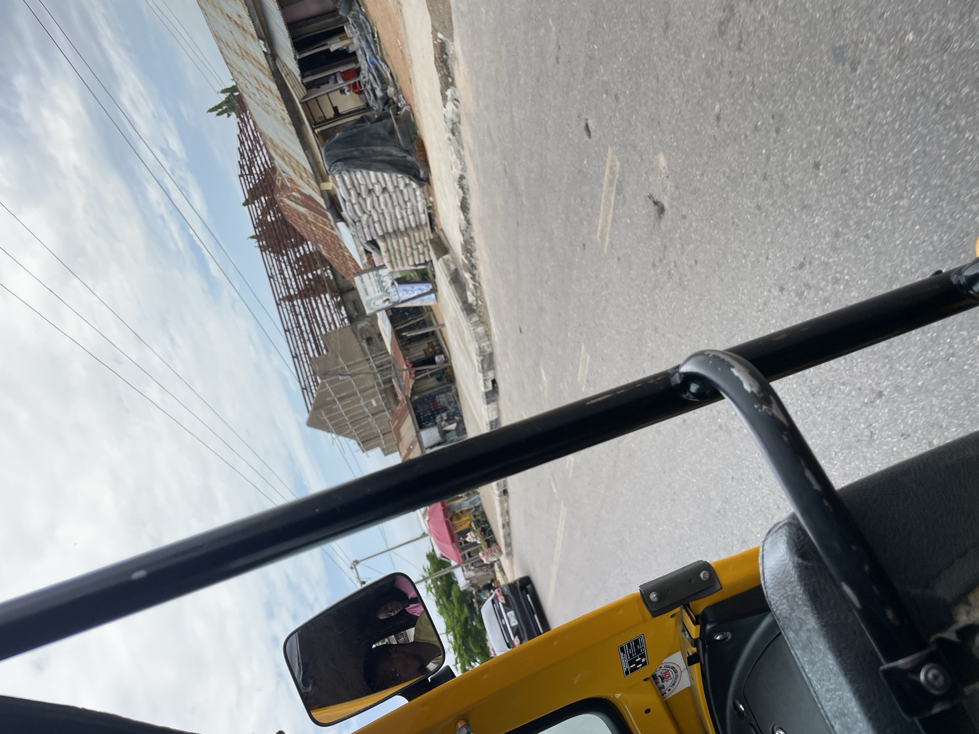 Street life and roadside commerce across a busy Jalingo morning