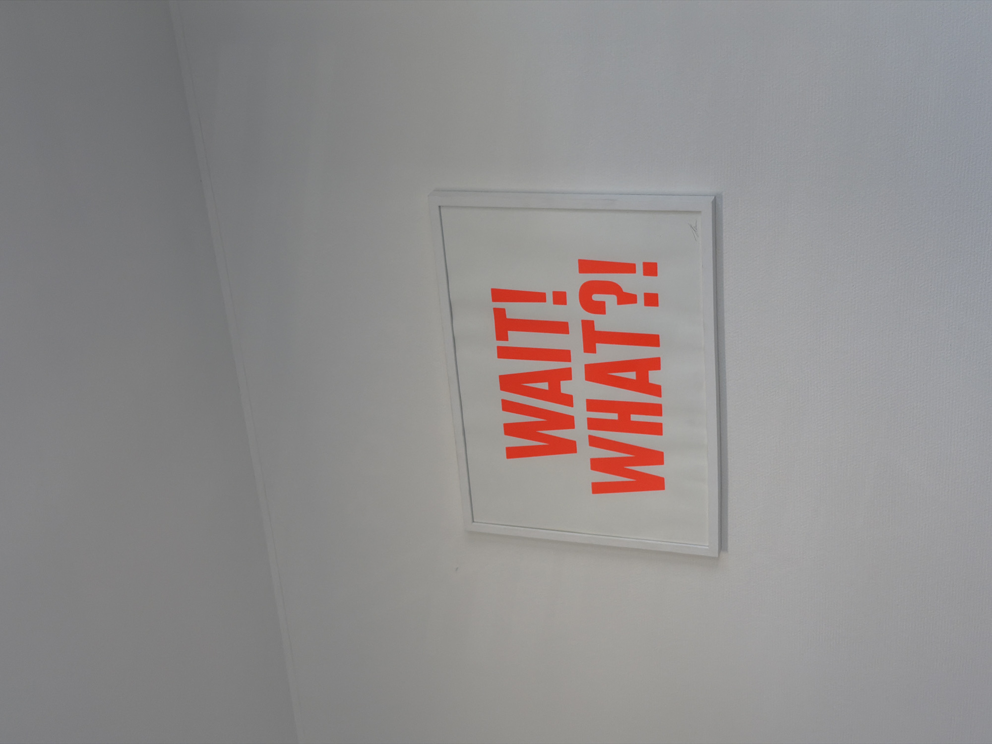 Decorative wall print spotted in Esch-sur-Alzette displays orange lettering