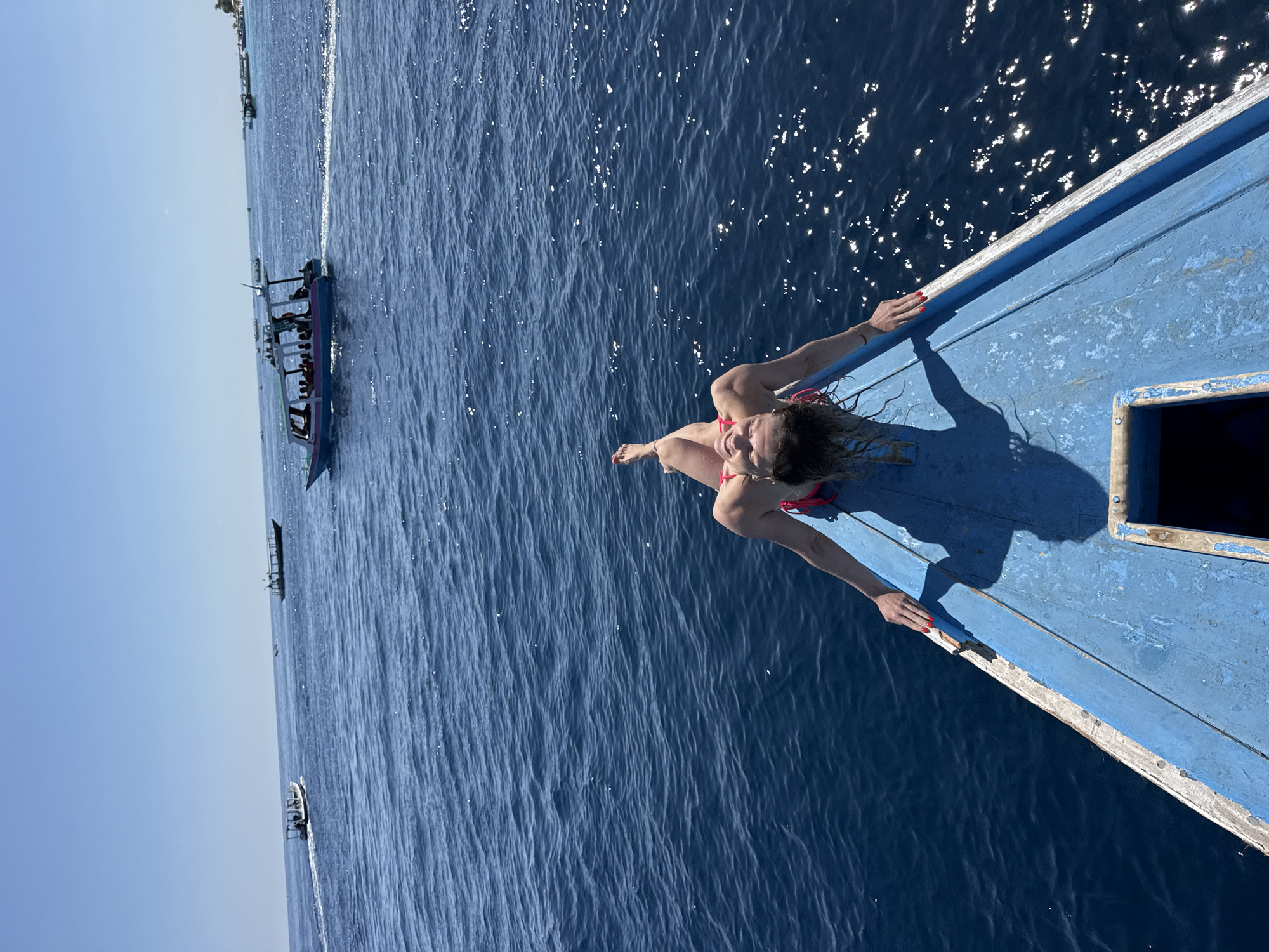 Boat bow hangout on open blue water, Indonesia