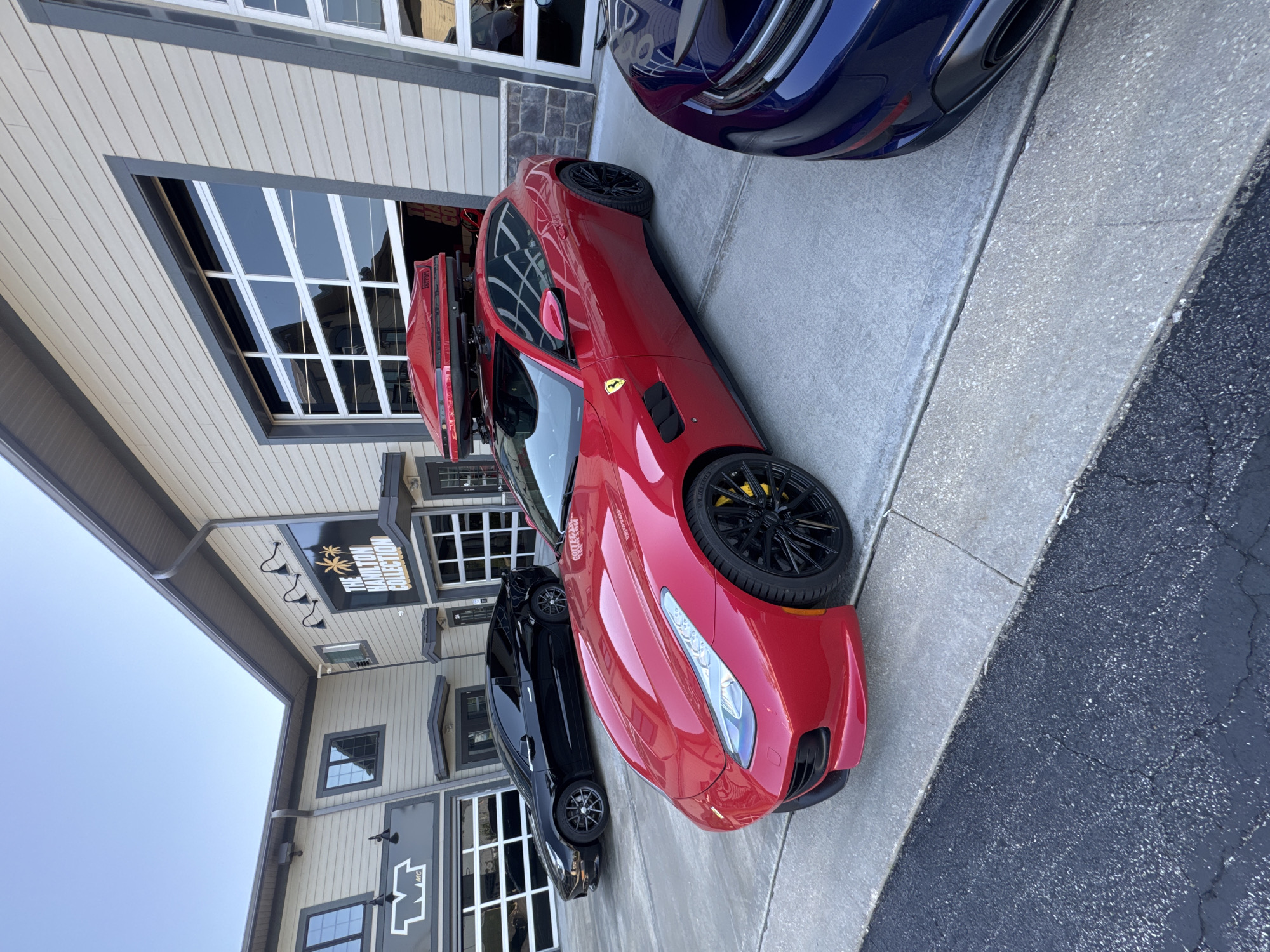 Luxury car dealership showcases multiple sports vehicles in Naperville