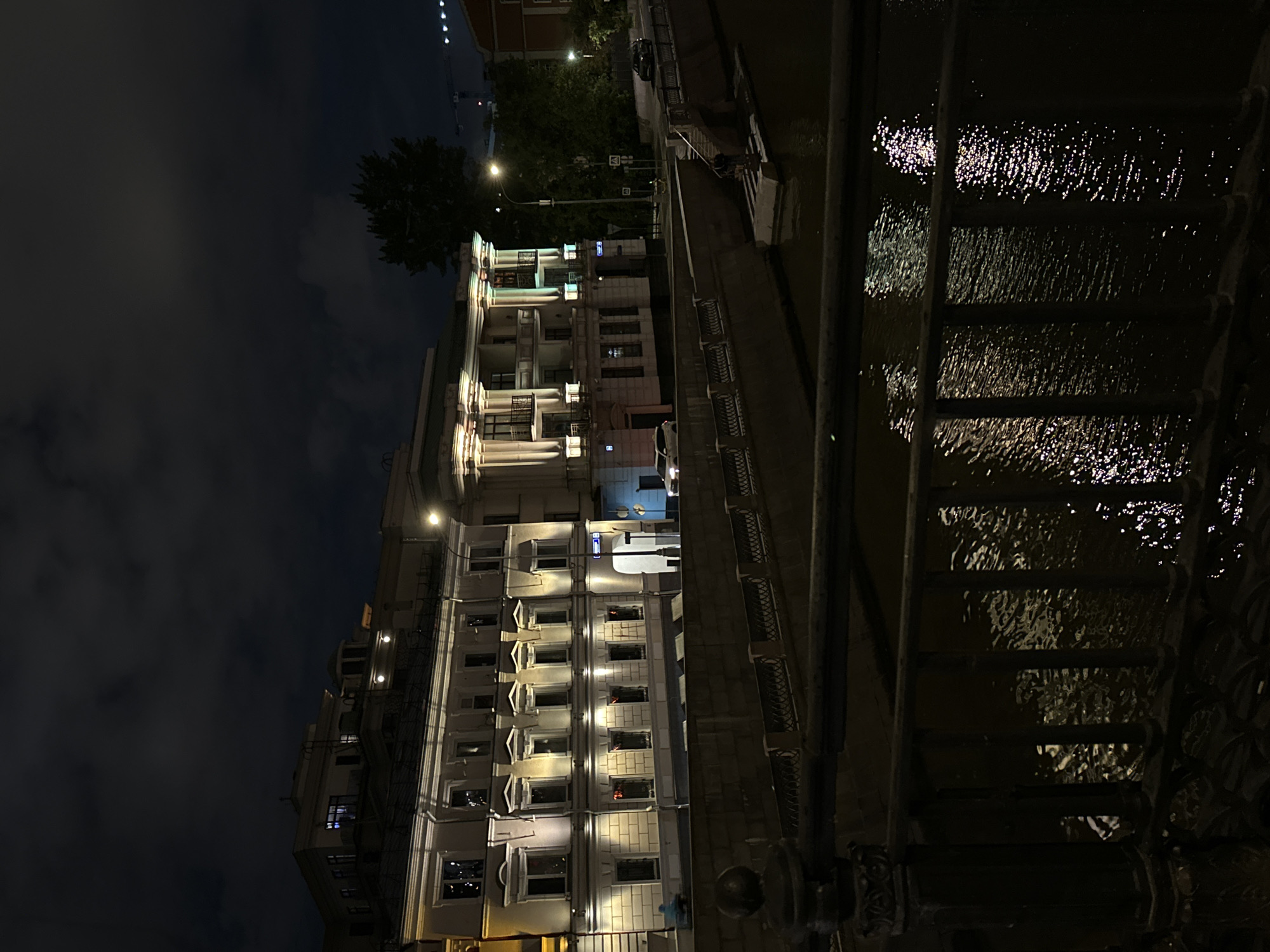 Moscow Music House photographed at night from waterfront