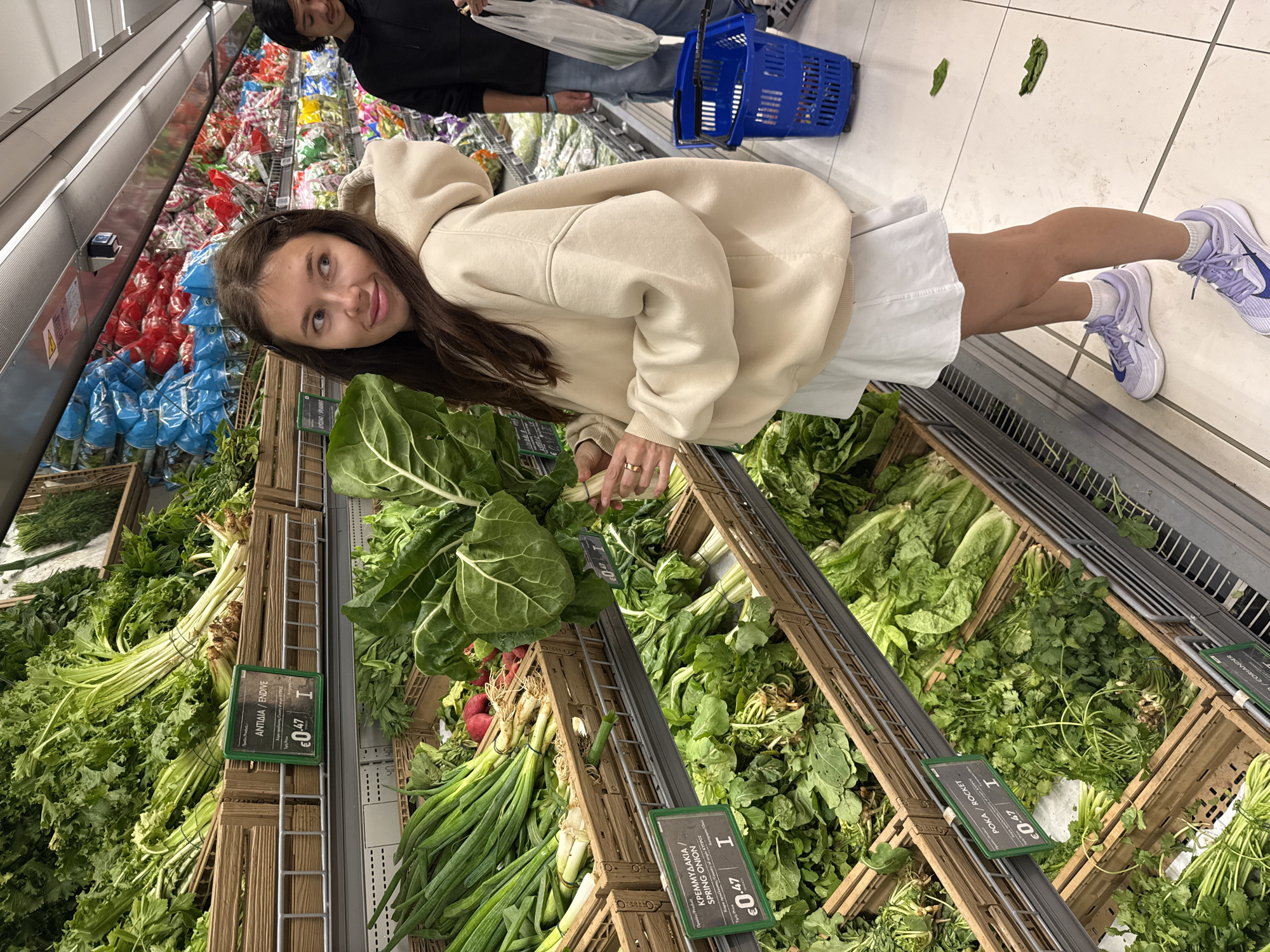 Woman shops for produce at Larnaca supermarket
