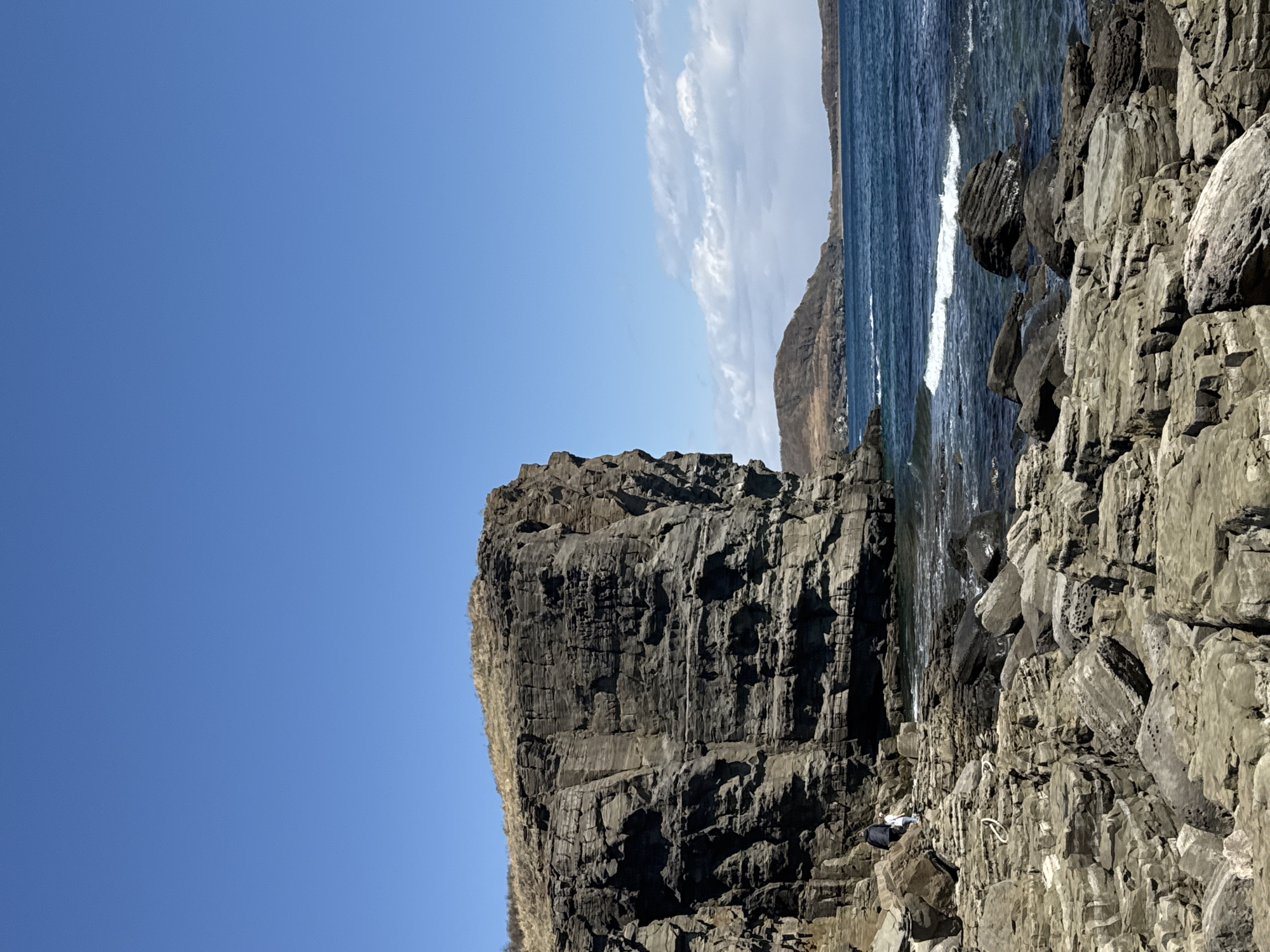 Clear skies frame dramatic coastal cliffs at Russky Island