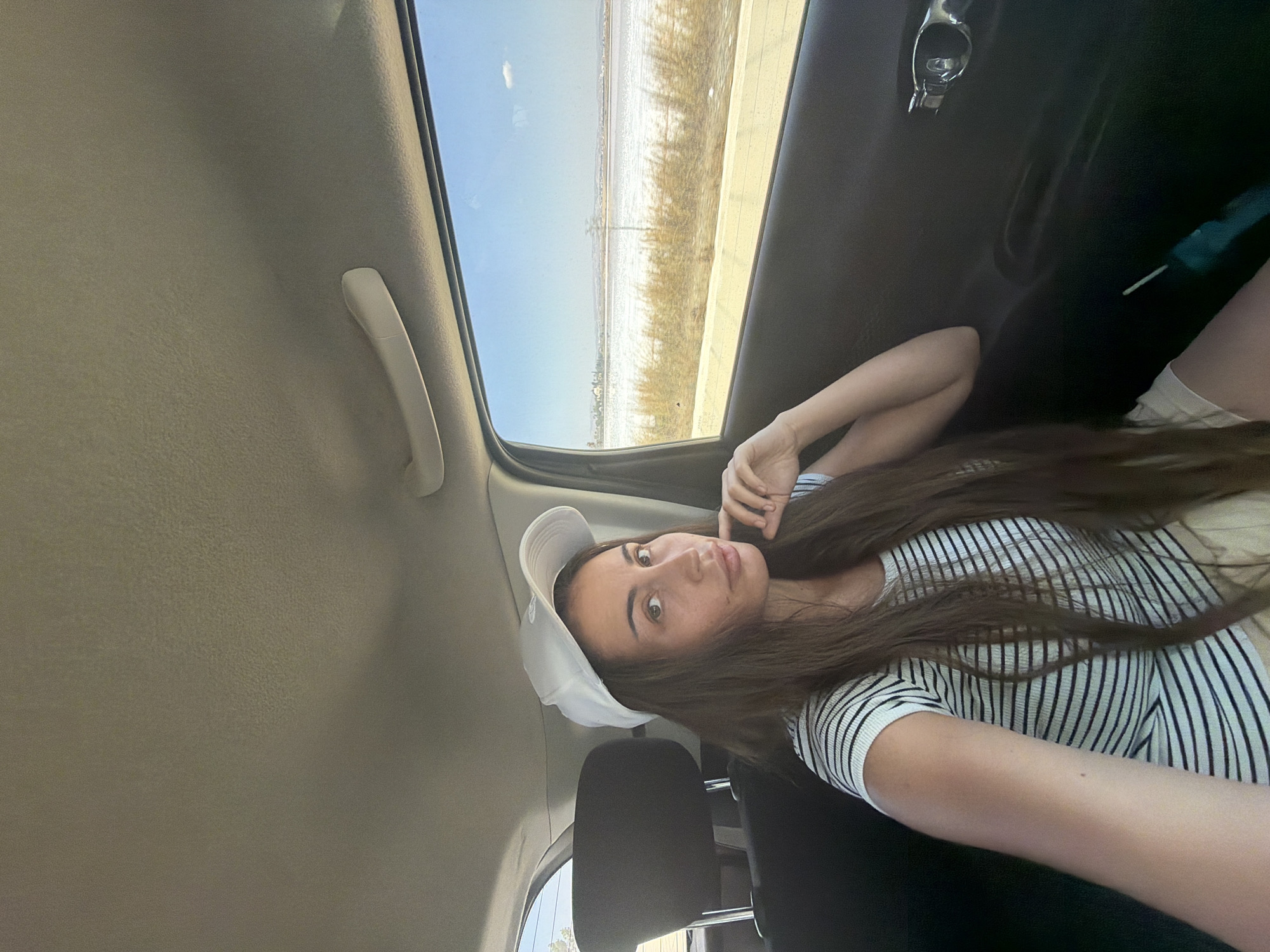 Relaxed back-seat moment on the road in Larnaca, Cyprus.