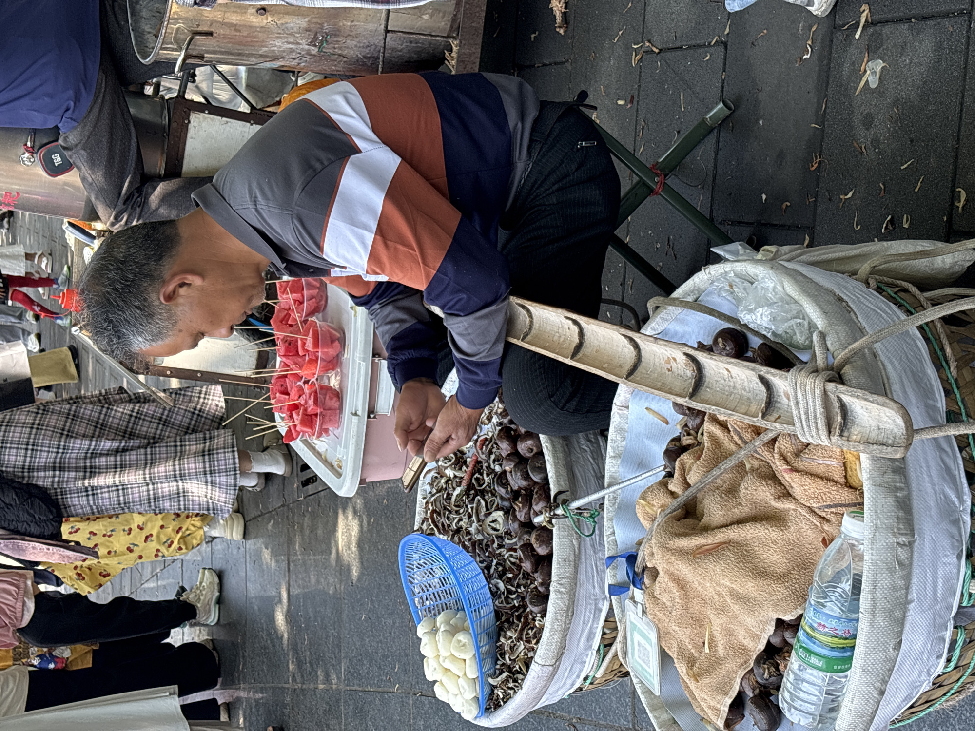 Morning street market activity observed in Jiulongpo District, China