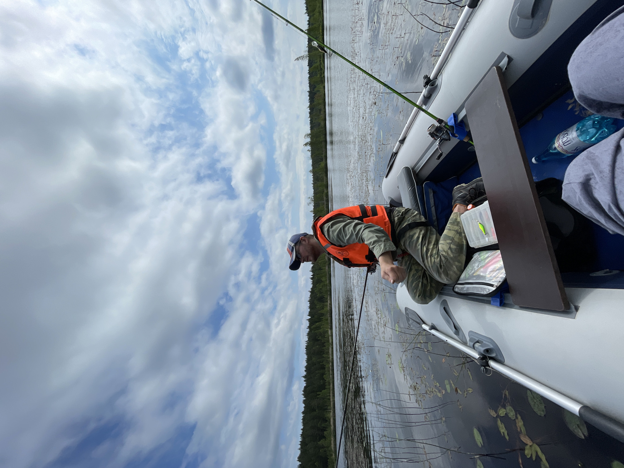 Morning fishing and water lilies observed on Russian lake