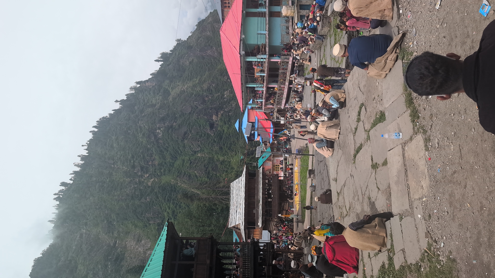 Community gathering in Malana's traditional mountain village