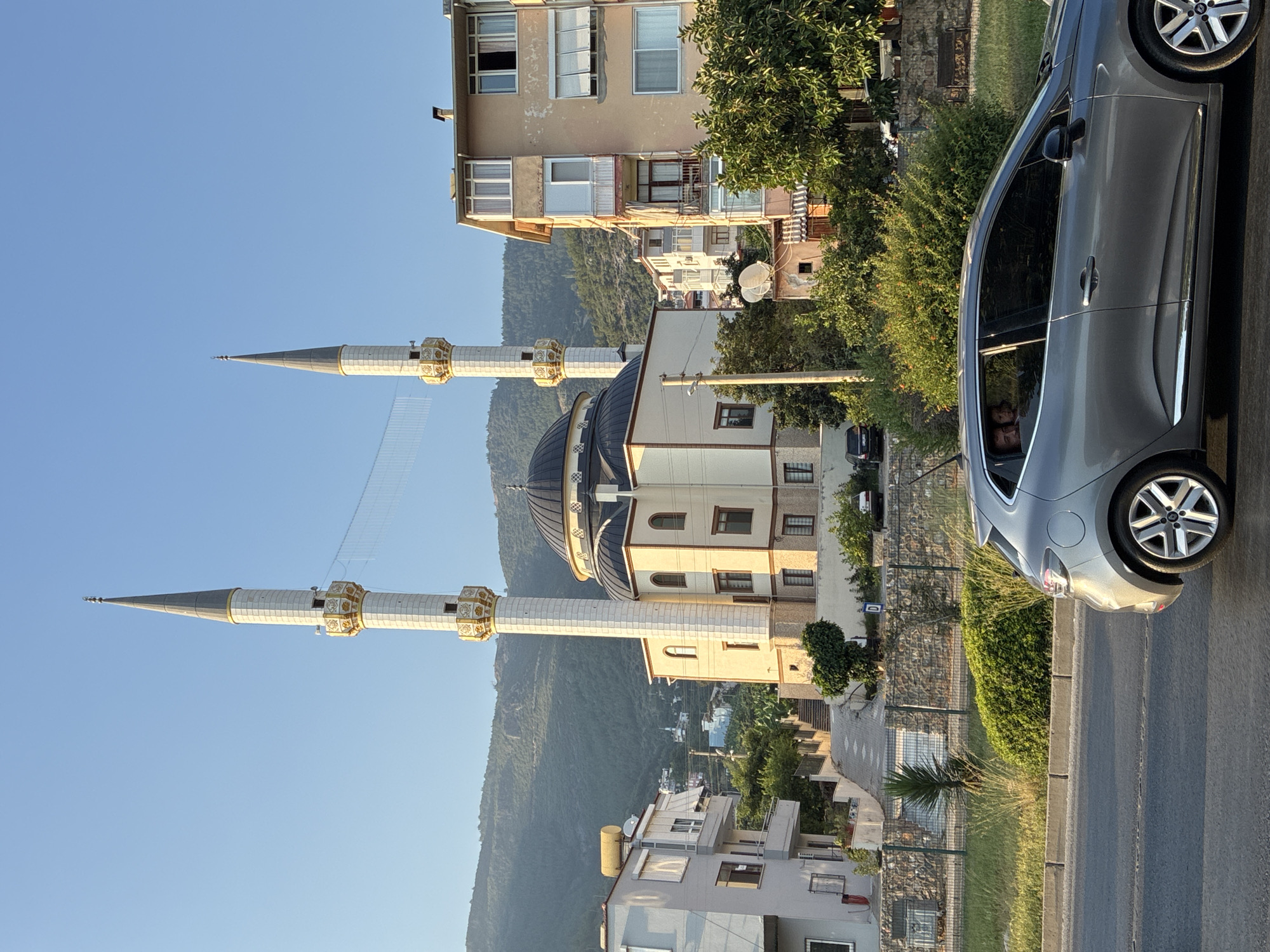 Sunny afternoon street scene near a mosque in Alanya