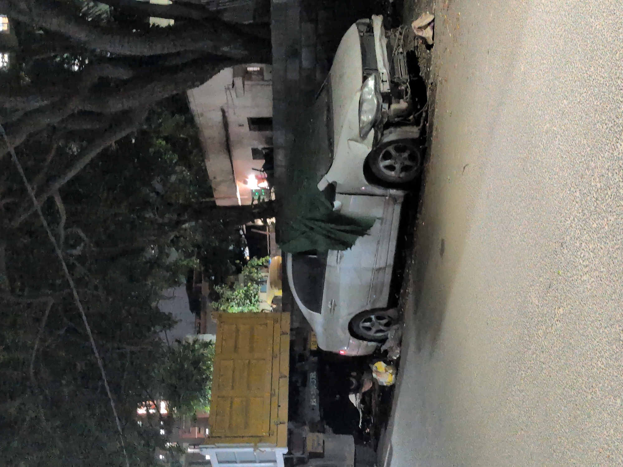 Bengaluru nighttime fireworks celebration mixed with everyday street life