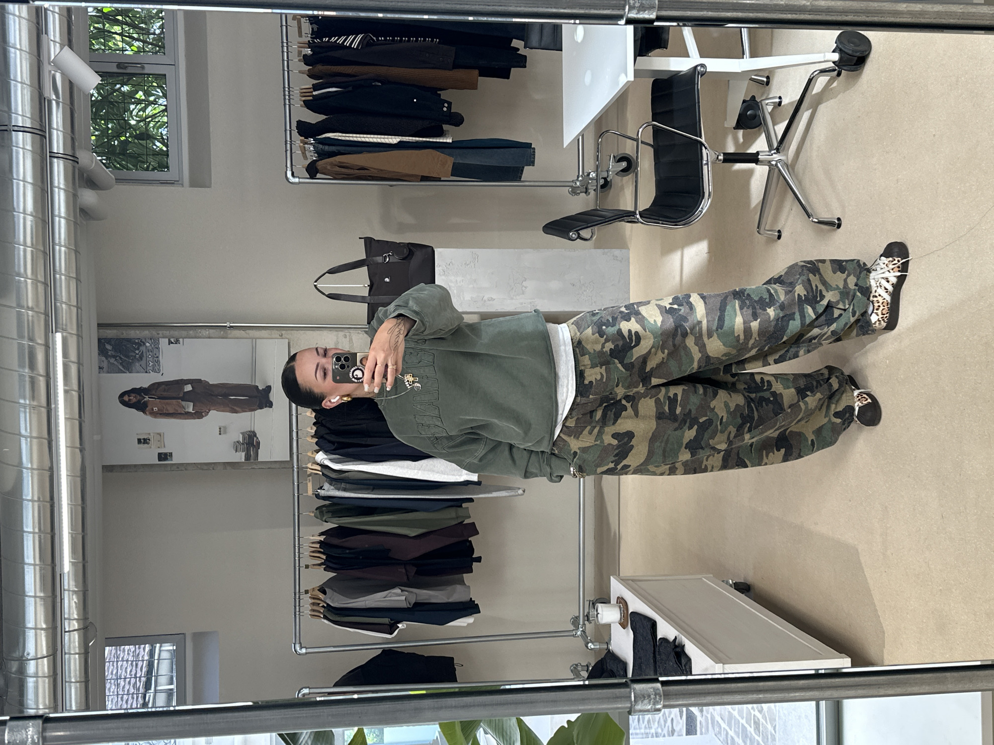 Shopper Documents Paris Clothing Store Visit Through Mirror Selfies