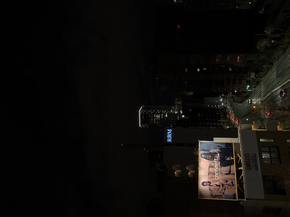 Aerial nighttime view captured over Shibuya streets from elevation