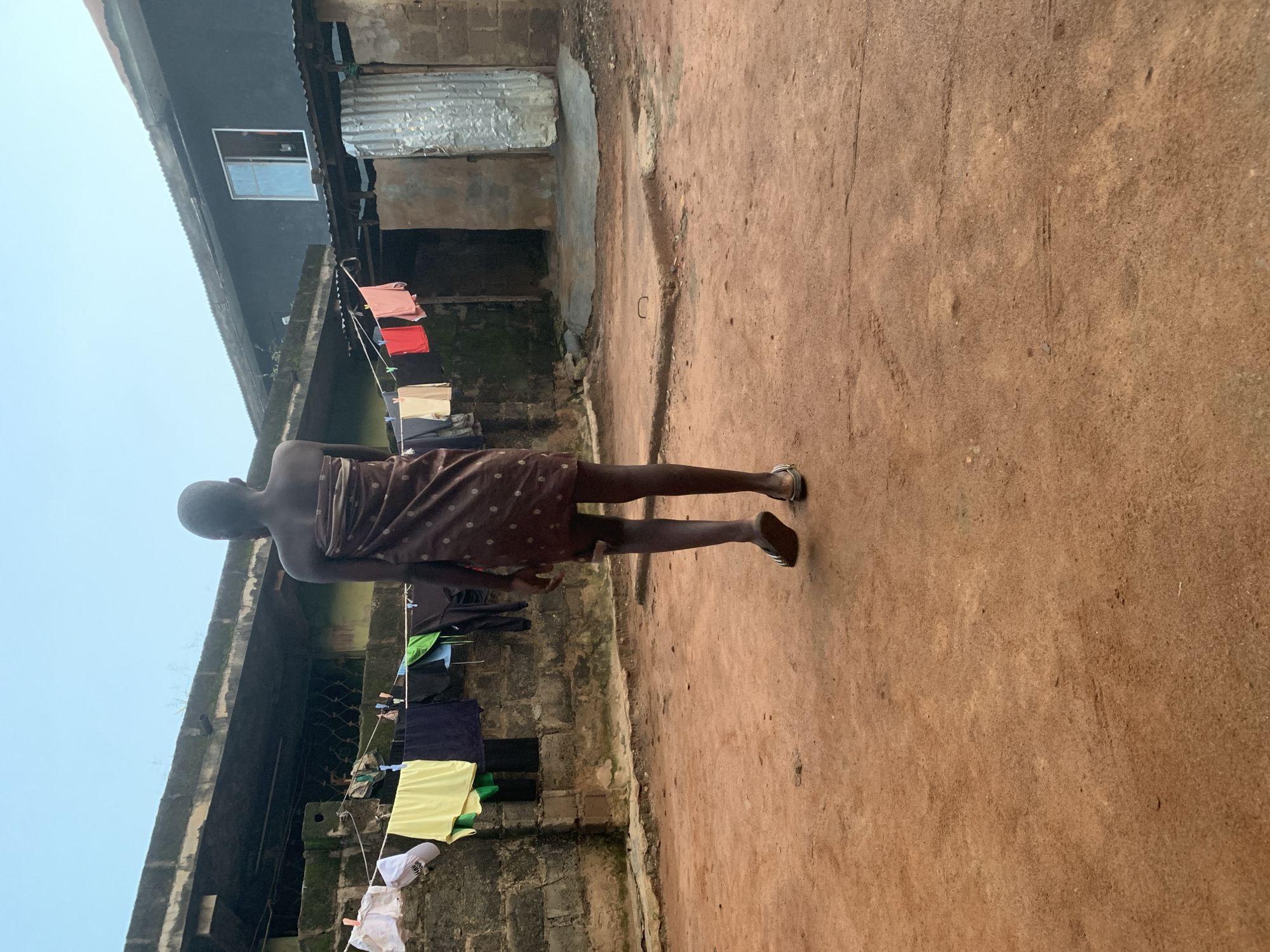 Daily life in a Shagamu courtyard — chores, fire, and portraits