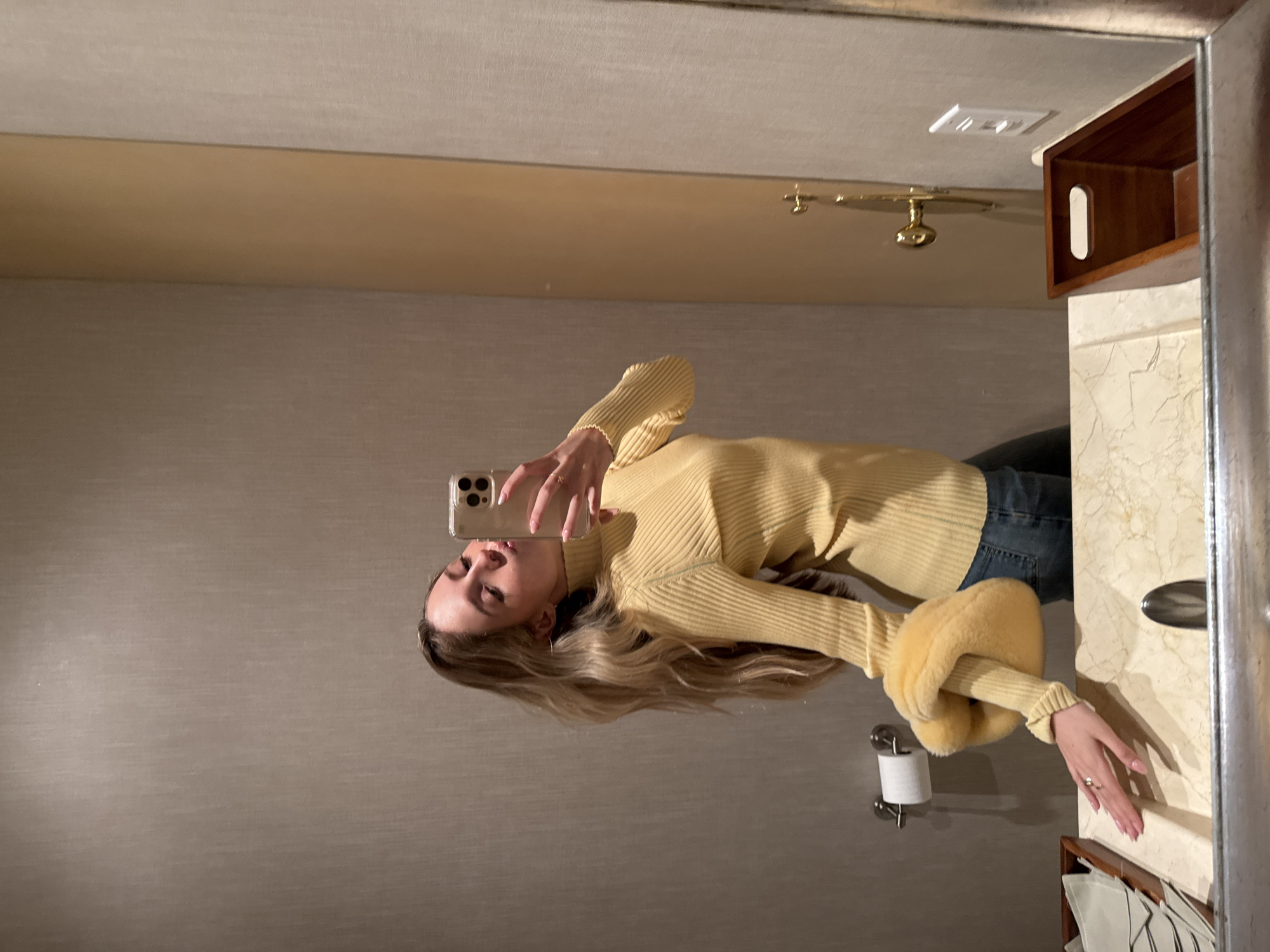 Woman takes bathroom selfie in Mexico City early morning