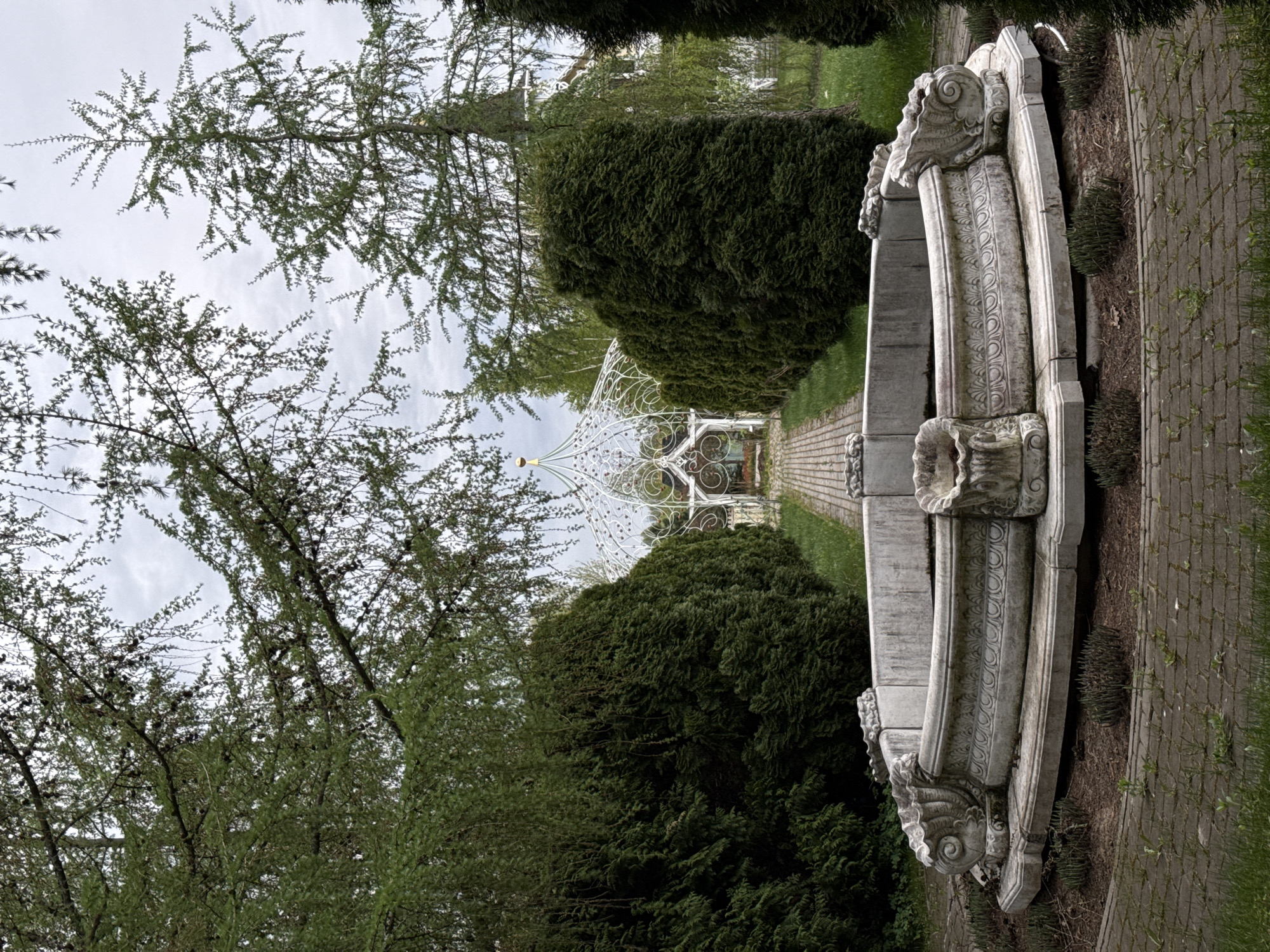 Park scene documented in Sapronovo featuring fountain and gazebo