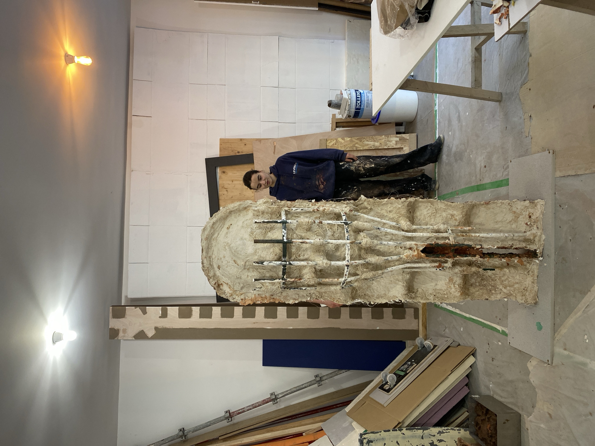 Artists work on large sculpture in Paris studio