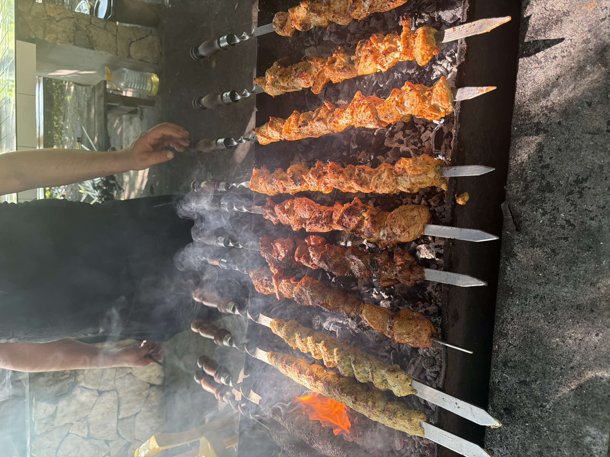 Riverside dining and grilling captured in Abzhanda, Abkhazia