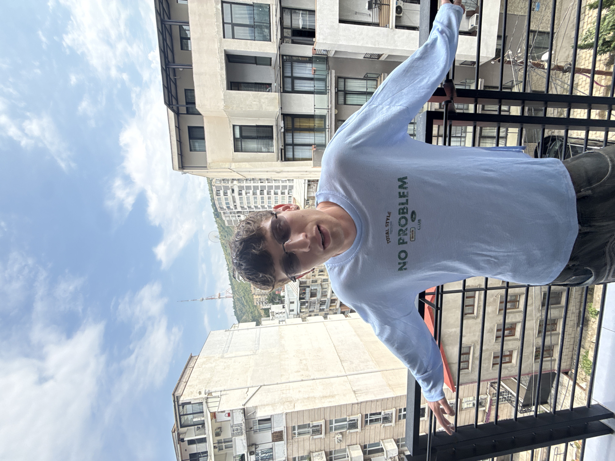 Balcony views and selfies across a Tbilisi afternoon