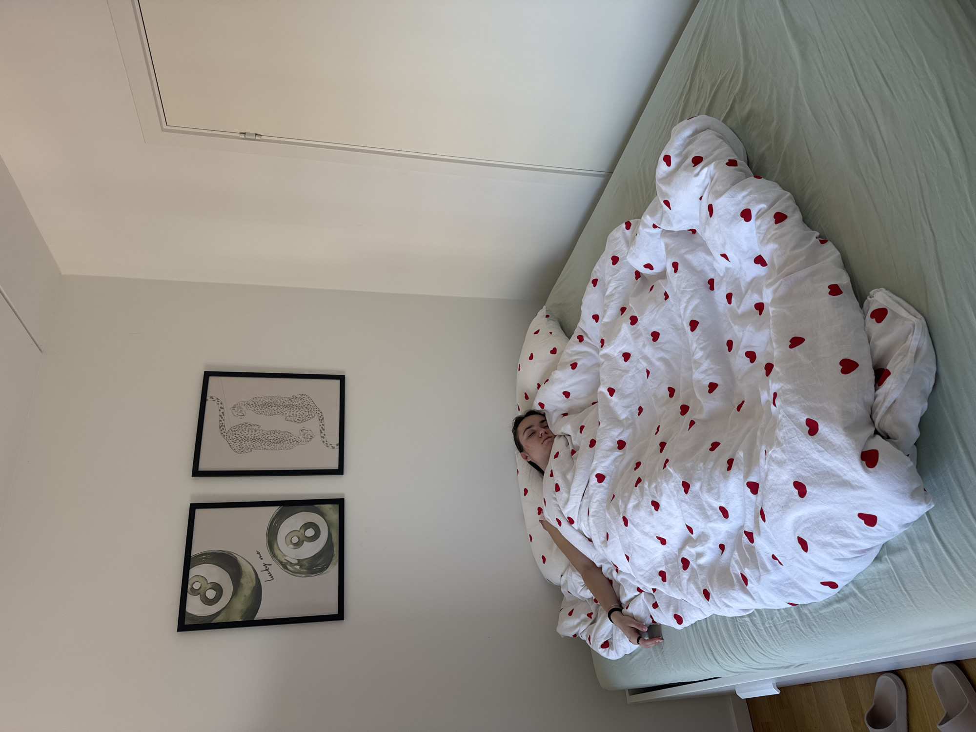 Woman rests in decorated bedroom in Copenhagen