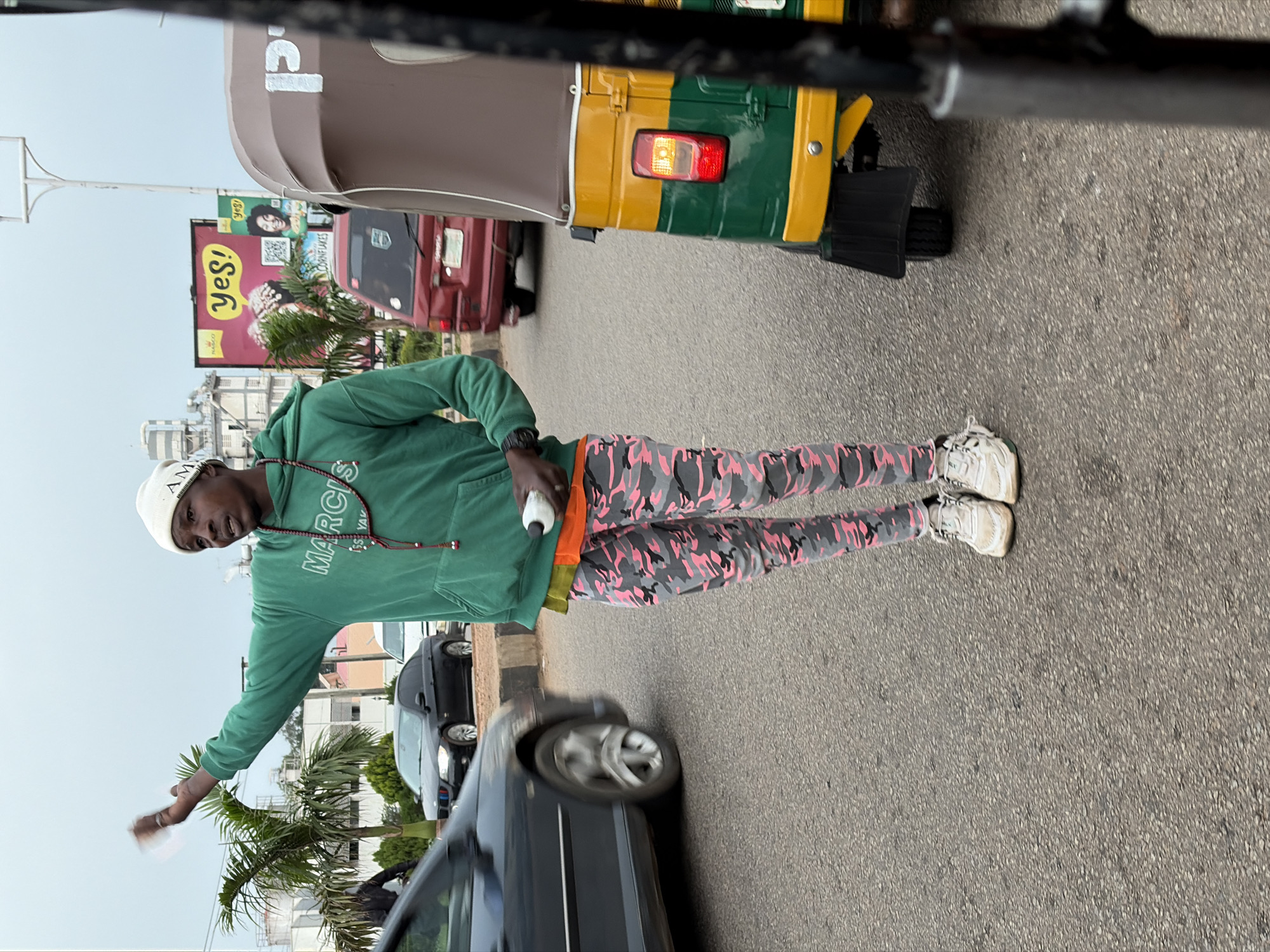 Standing on a paved road in Jos, Nigeria