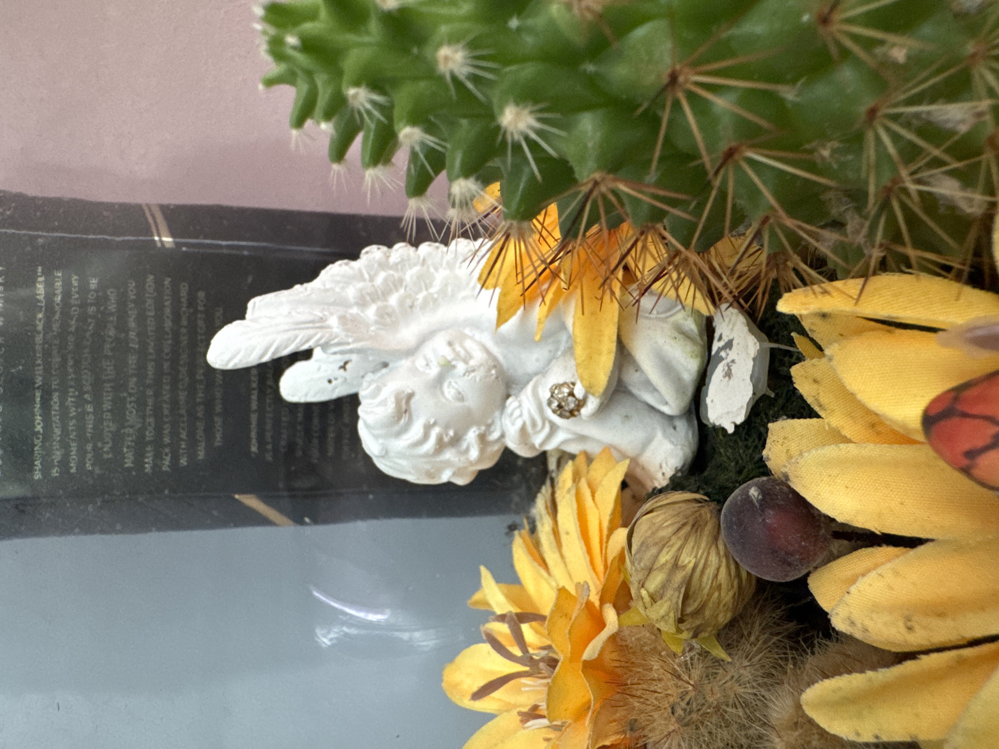 Decorative displays featuring cherub statue and ship model observed in Burgas