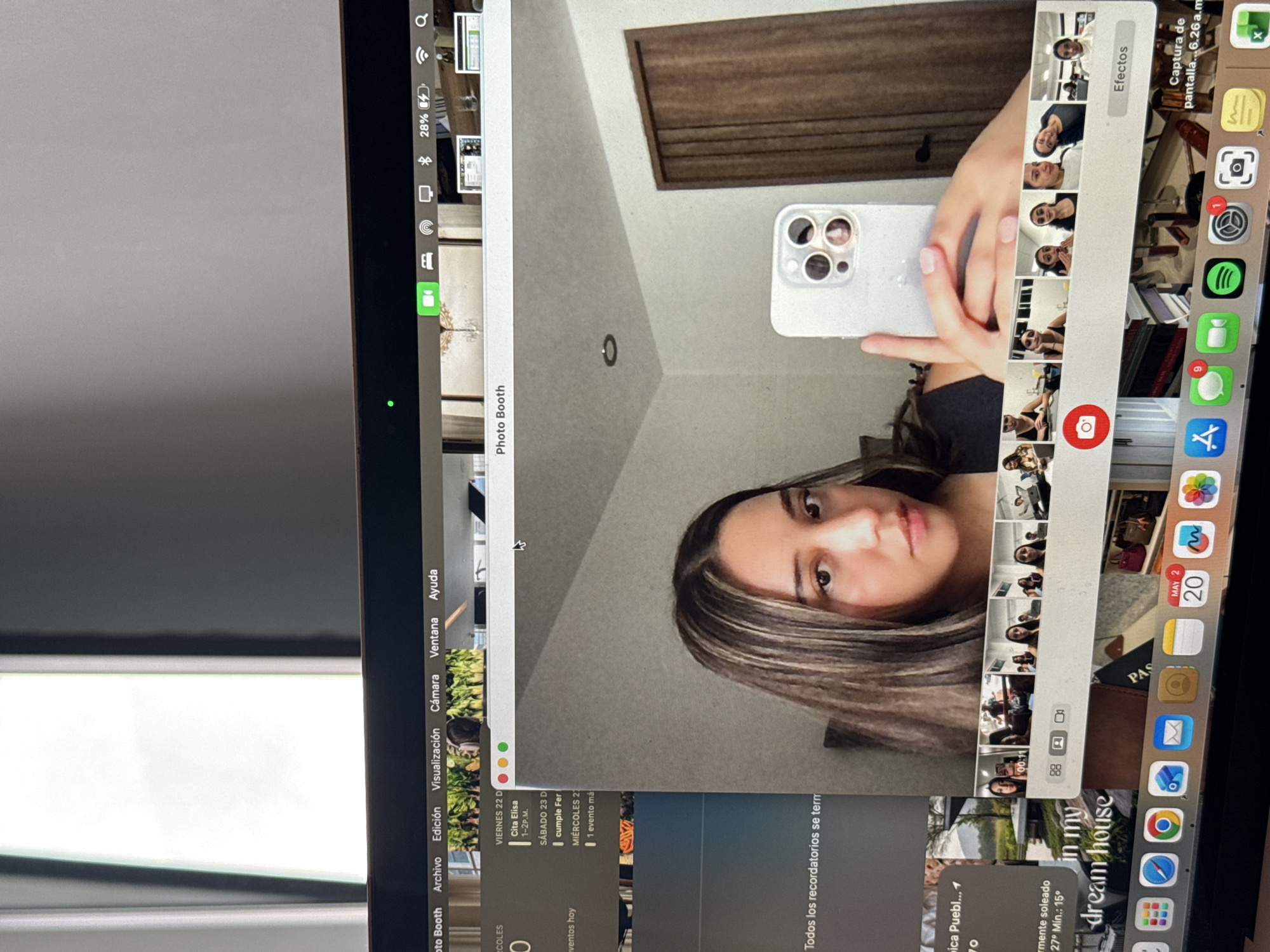 Woman takes iPhone selfies via MacBook Photo Booth in Puebla