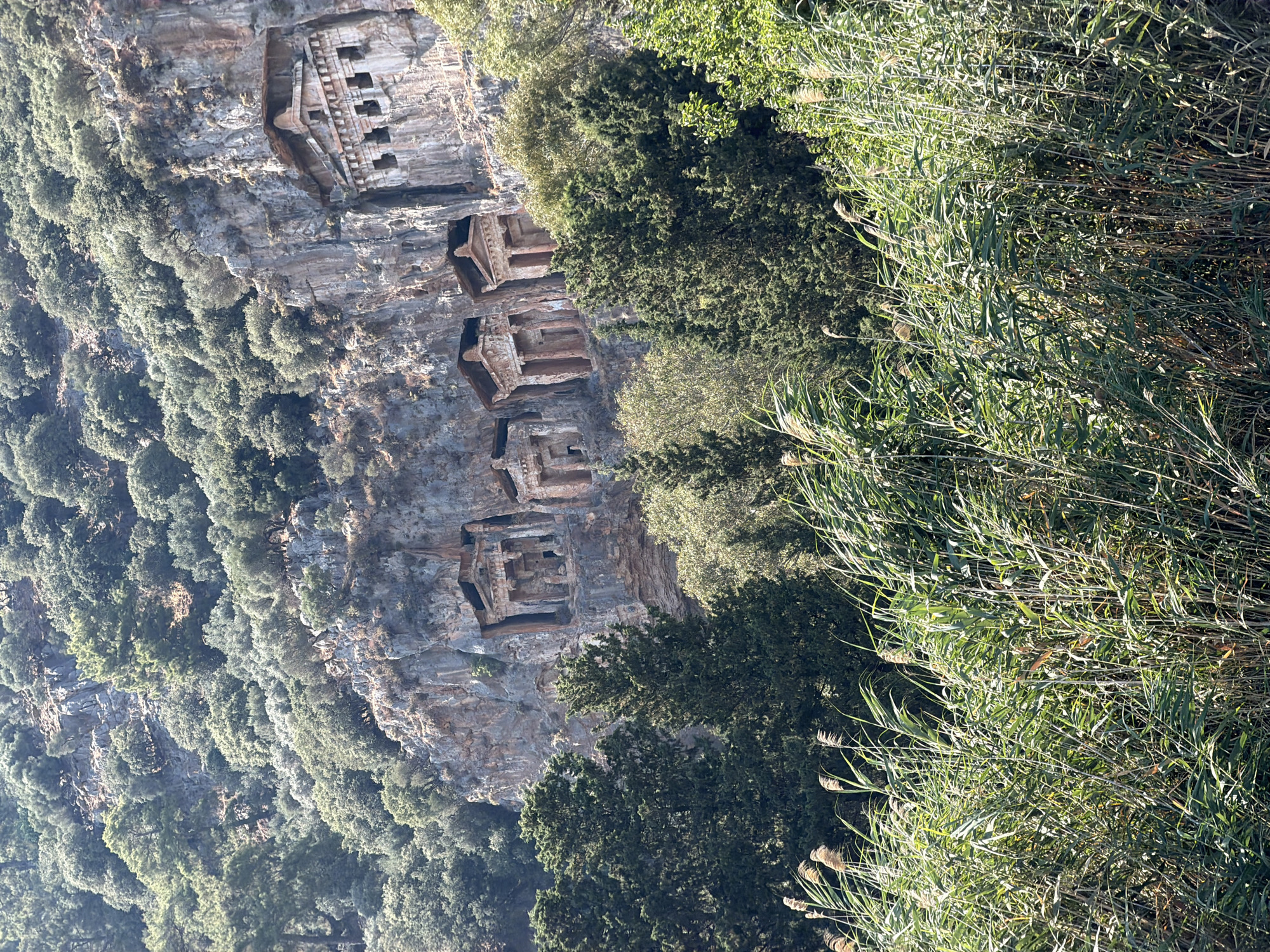 Ancient Lycian cliff tombs carved into rock face, Dalyan