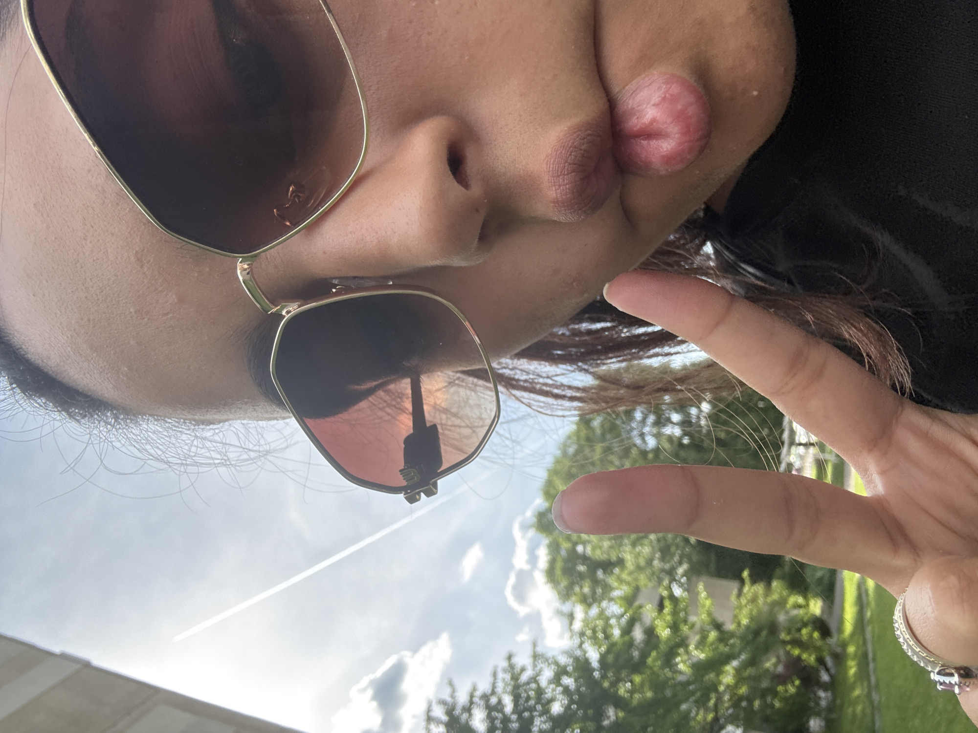 Person takes outdoor selfie in Sofia under cloudy skies