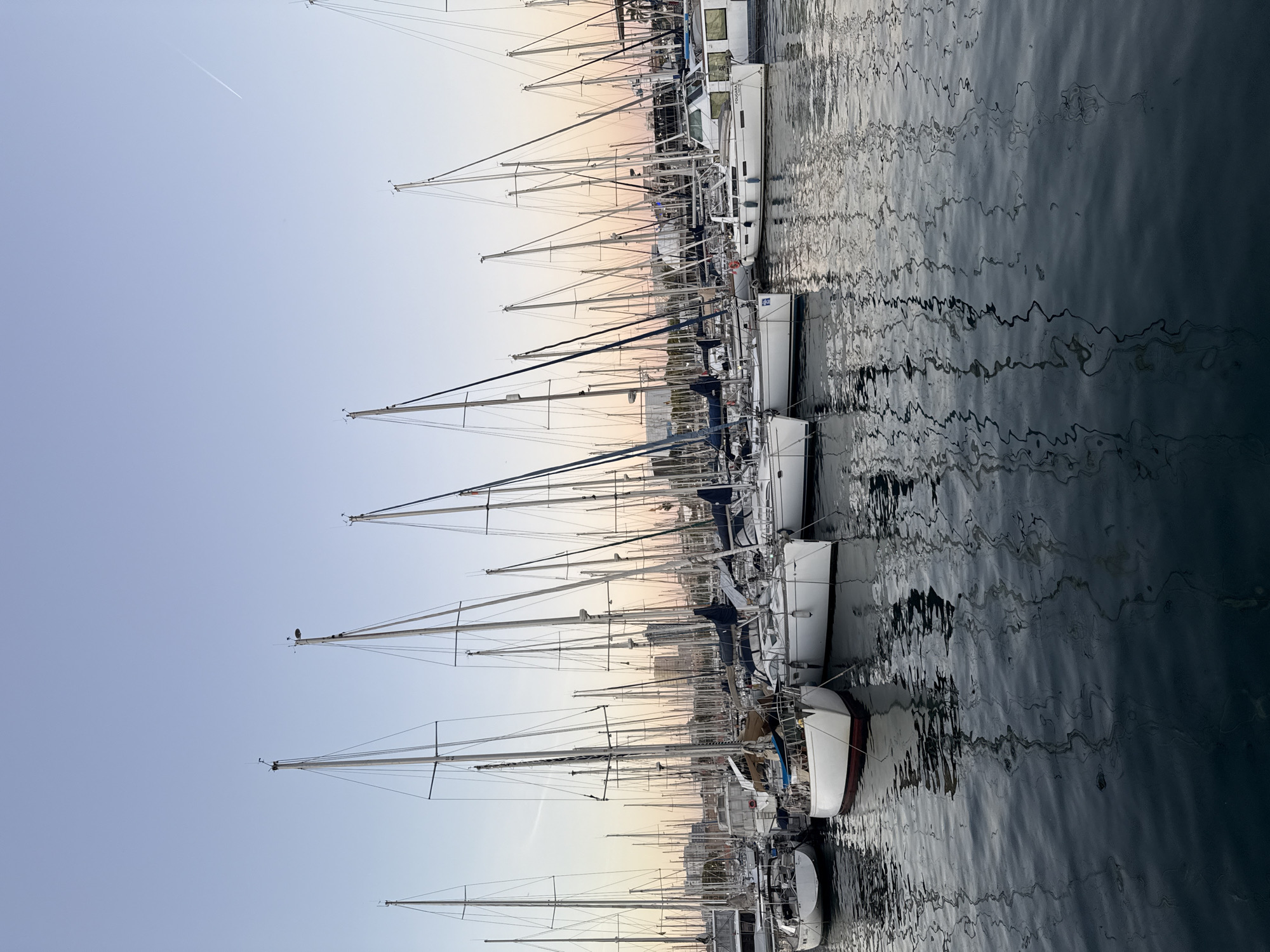 Evening stroll through Barcelona's waterfront captures dusk transition