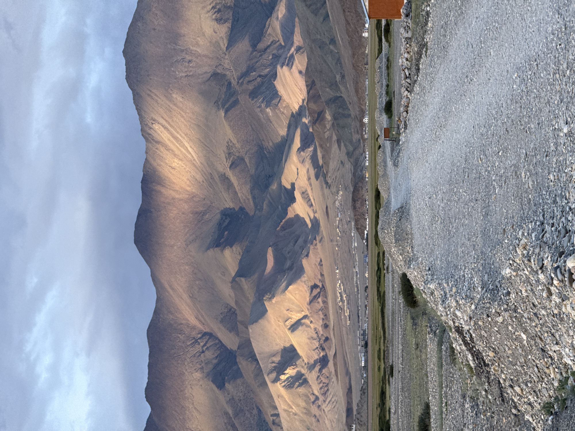 Remote mountain road under dramatic skies near Khuldo, India