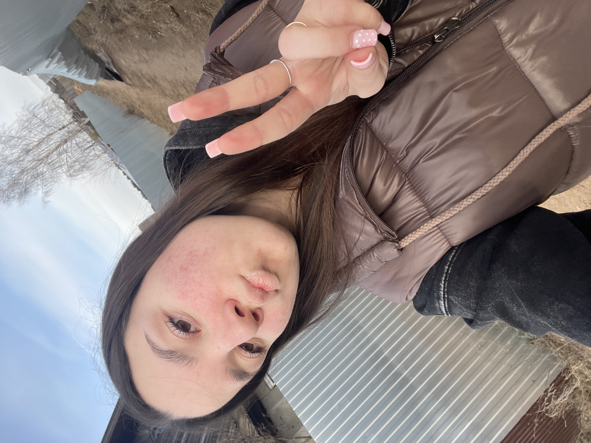 Woman takes selfies in rural Russian village