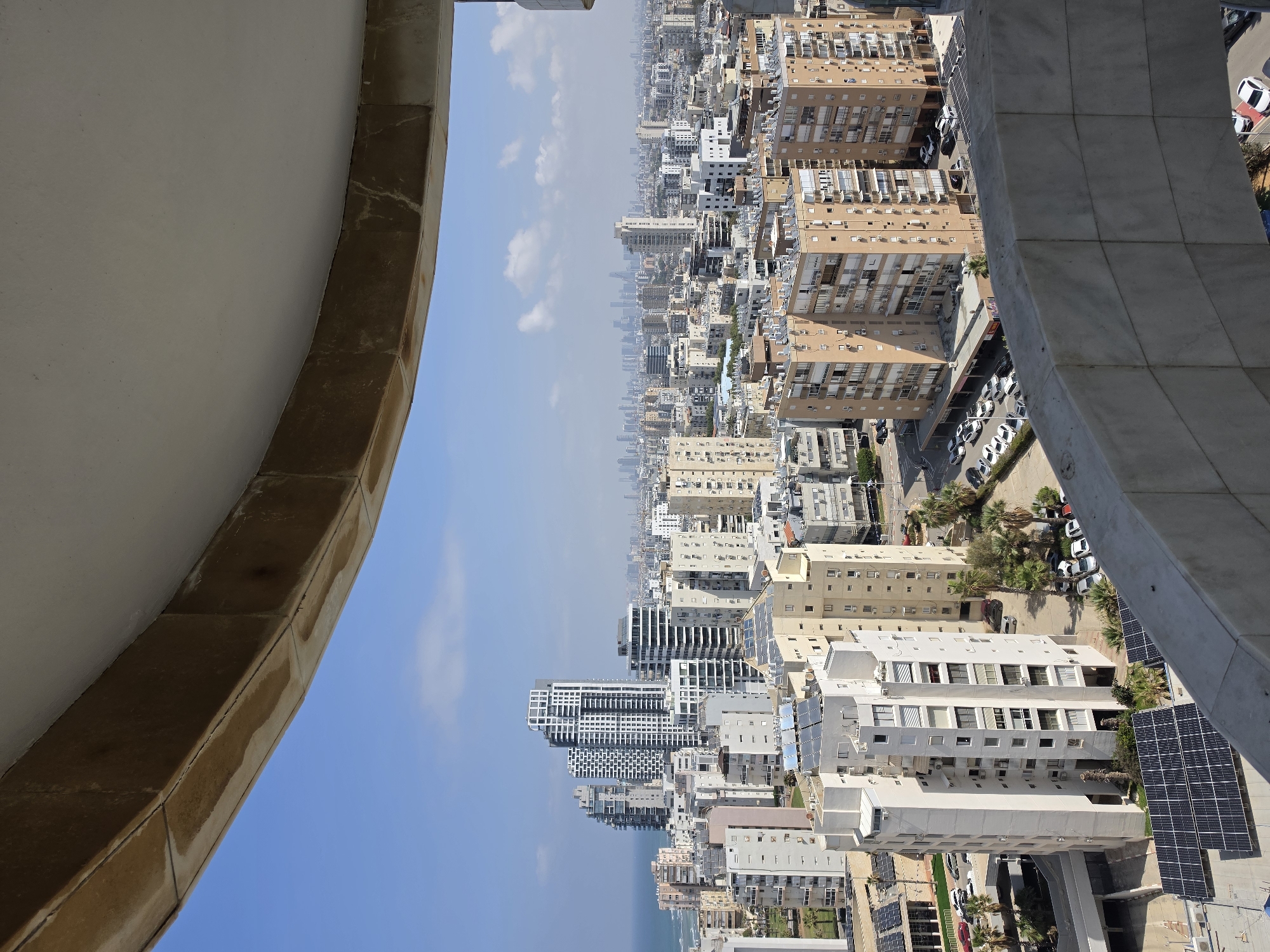 Aerial view captures Bat Yam cityscape and coastline