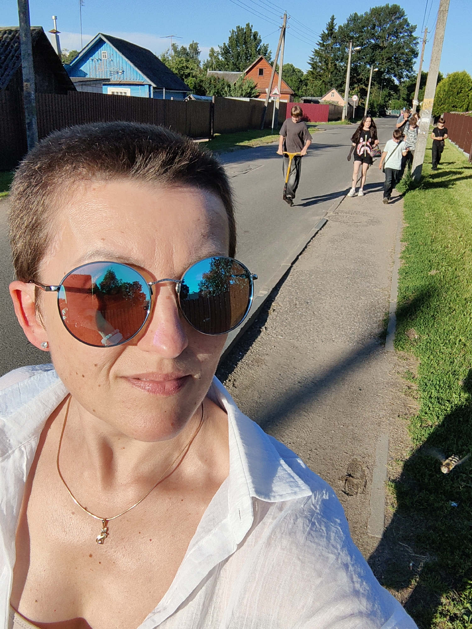 Sunny afternoon stroll through a quiet Fanipal neighborhood