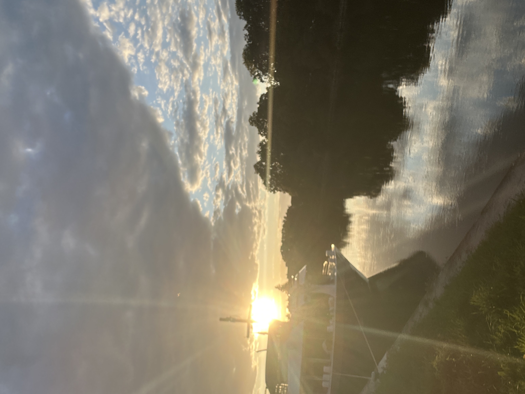 Golden sunset over the Danube with a docked ship in Regensburg