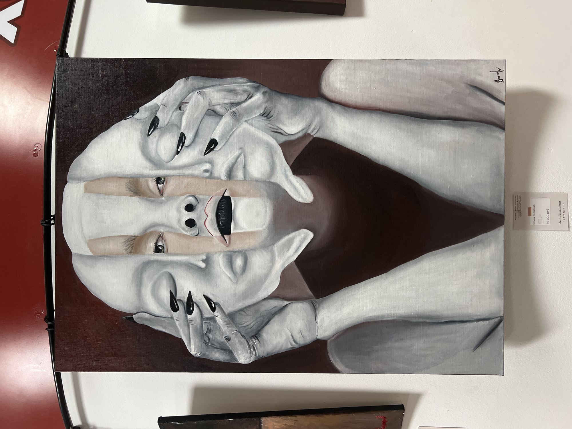 Surreal portrait painting observed in gallery exhibition setting