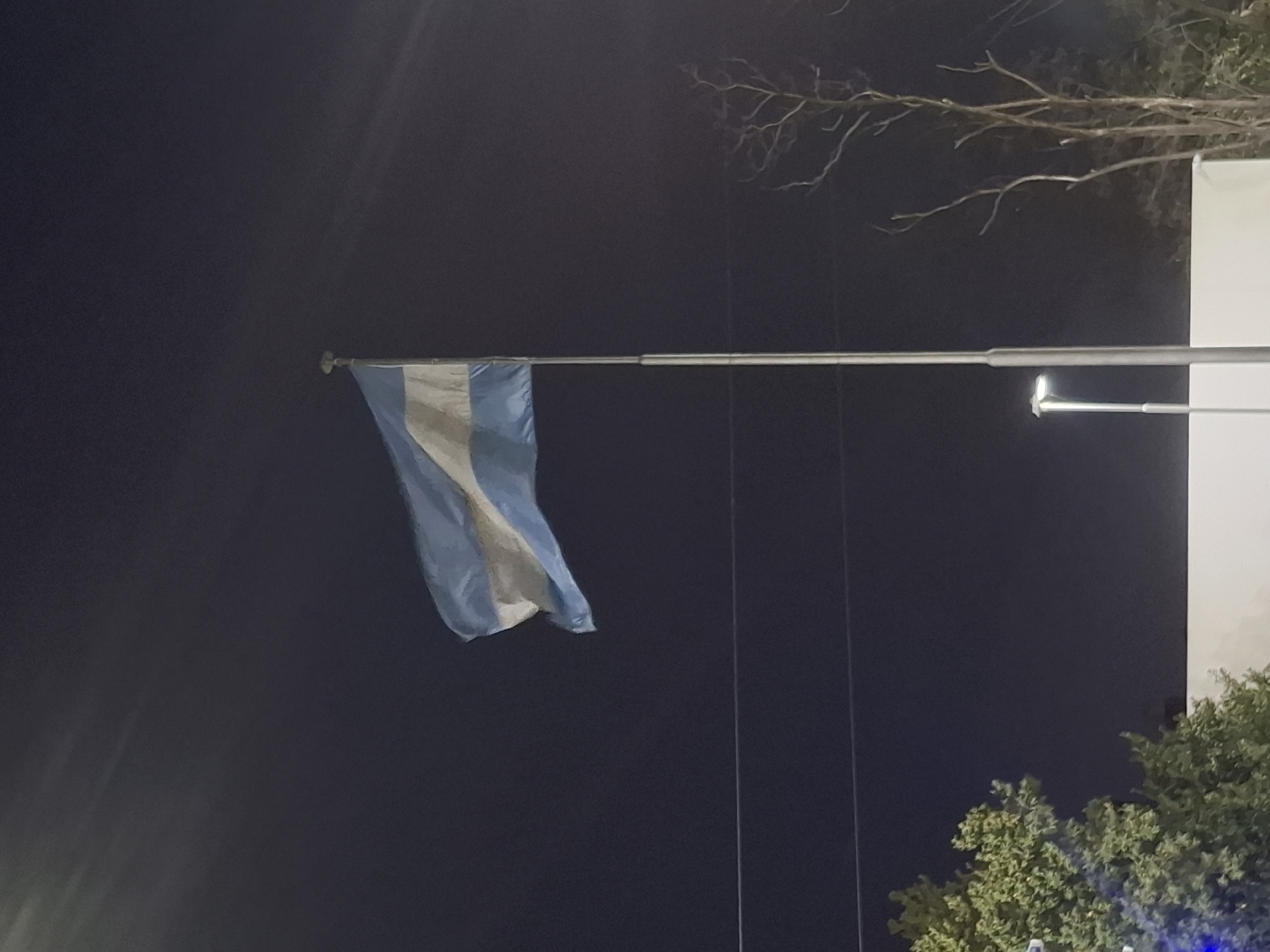 Argentine flag flying at night in Wilde