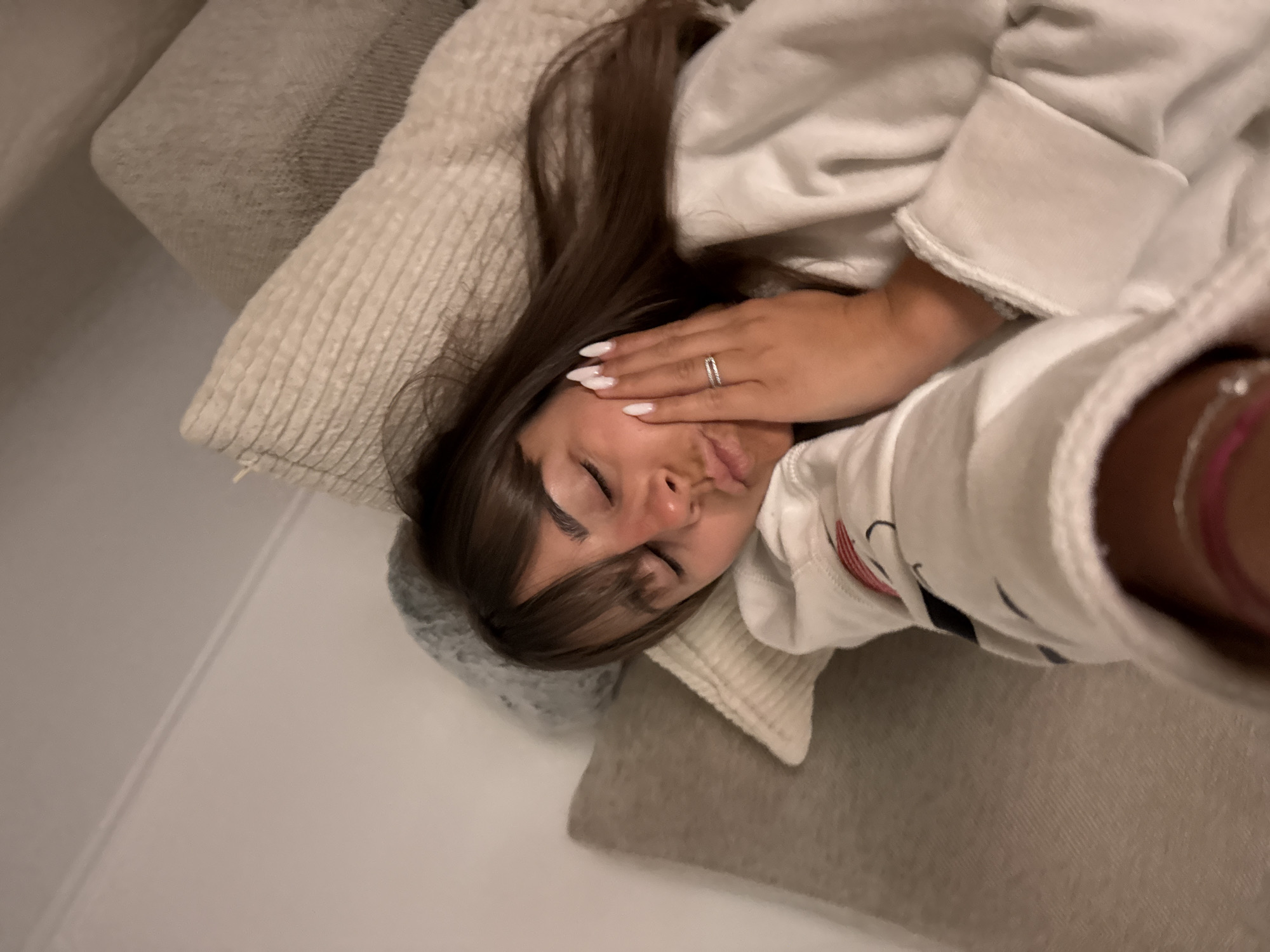 Person rests on couch in Cannes residence