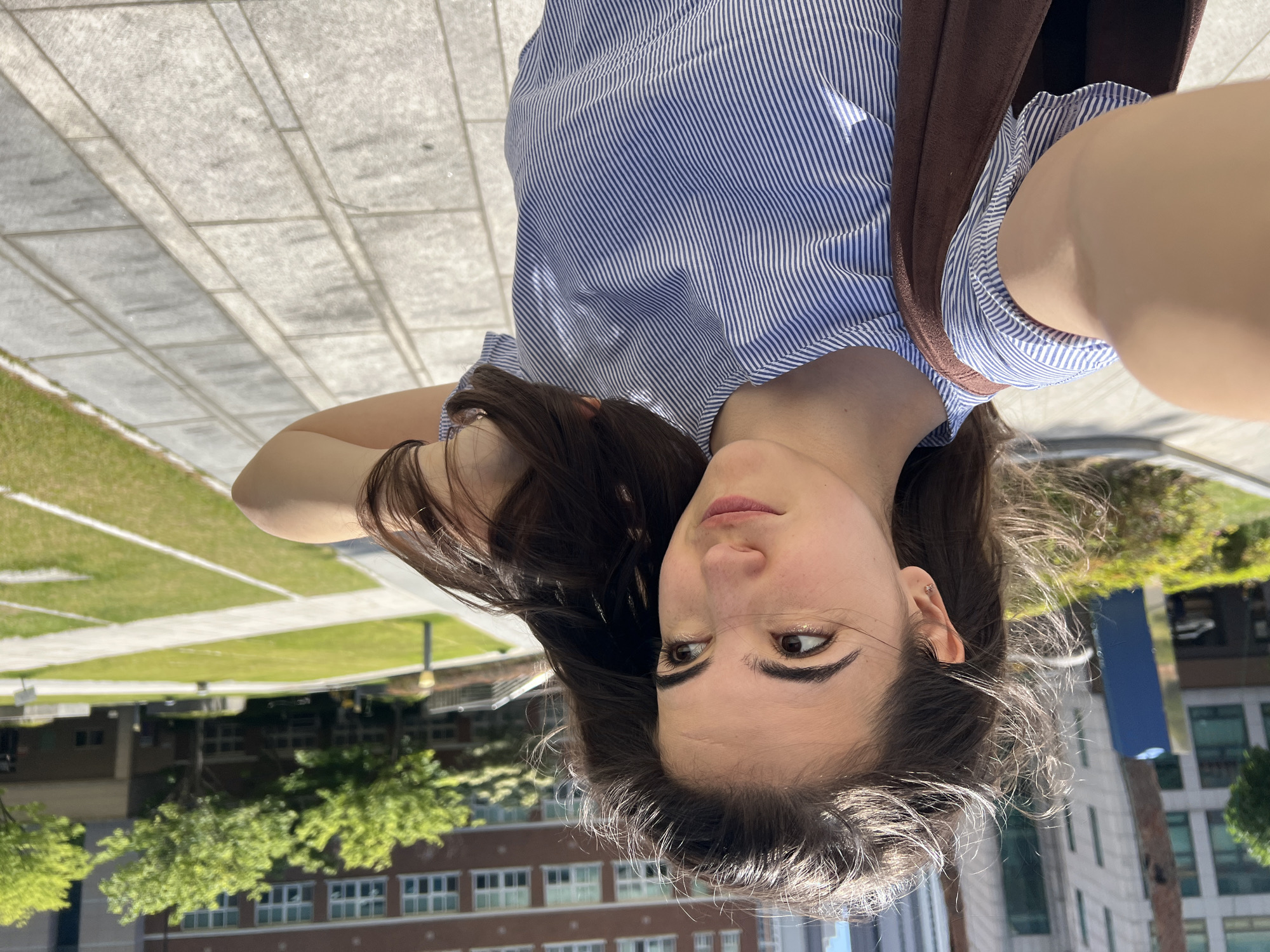 Woman takes outdoor selfies in Daegu during early morning hours
