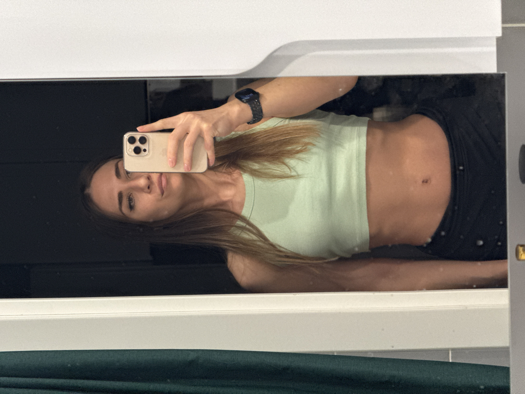 Woman takes mirror selfies in Lyubertsy bathroom