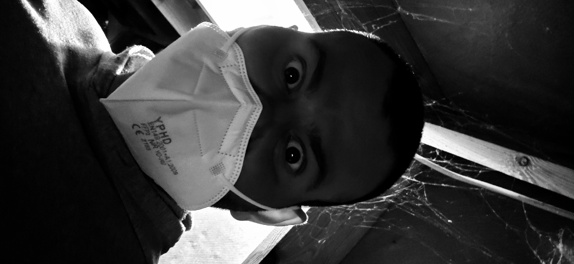 Person in marked medical mask photographed in Barntrup, Germany