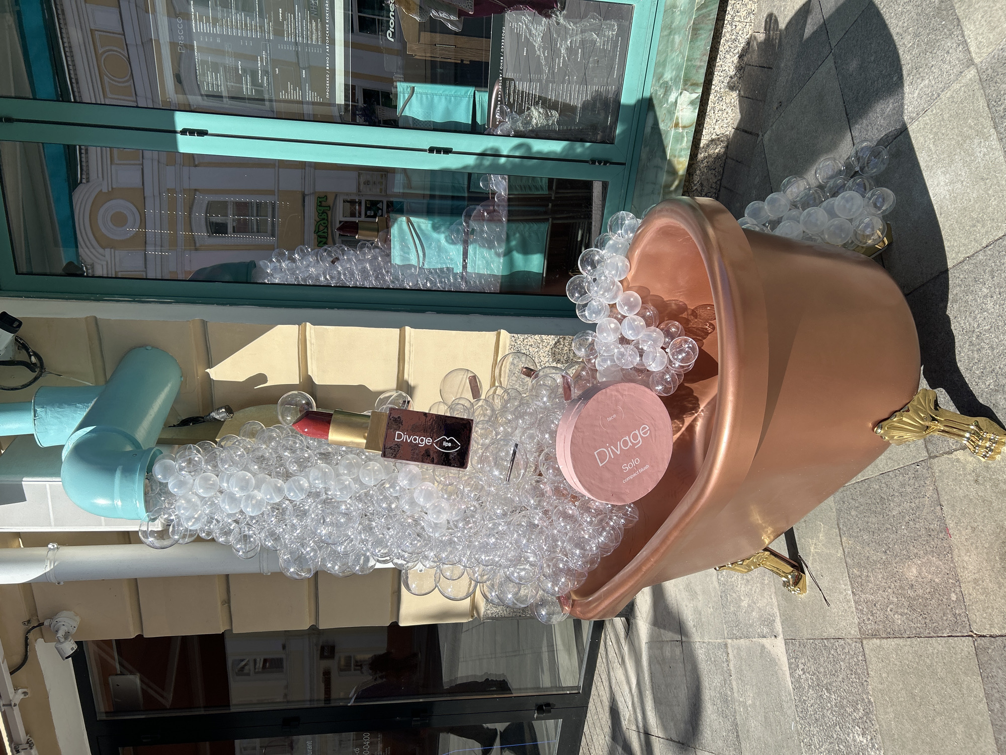 Rose gold bathtub advertisement spotted on Moscow sidewalk