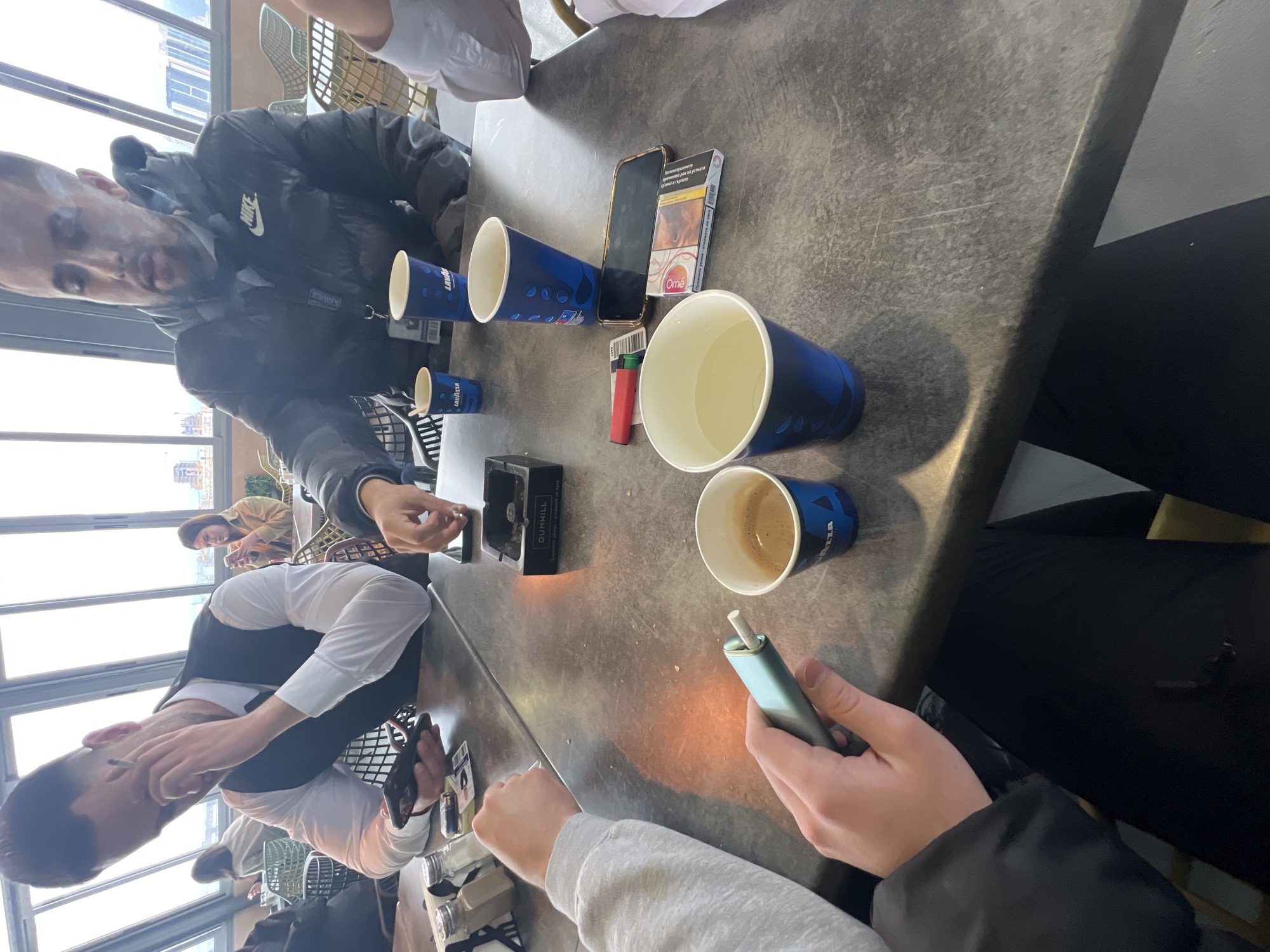 Coffee gathering at Sofia cafe with cigarettes and conversation
