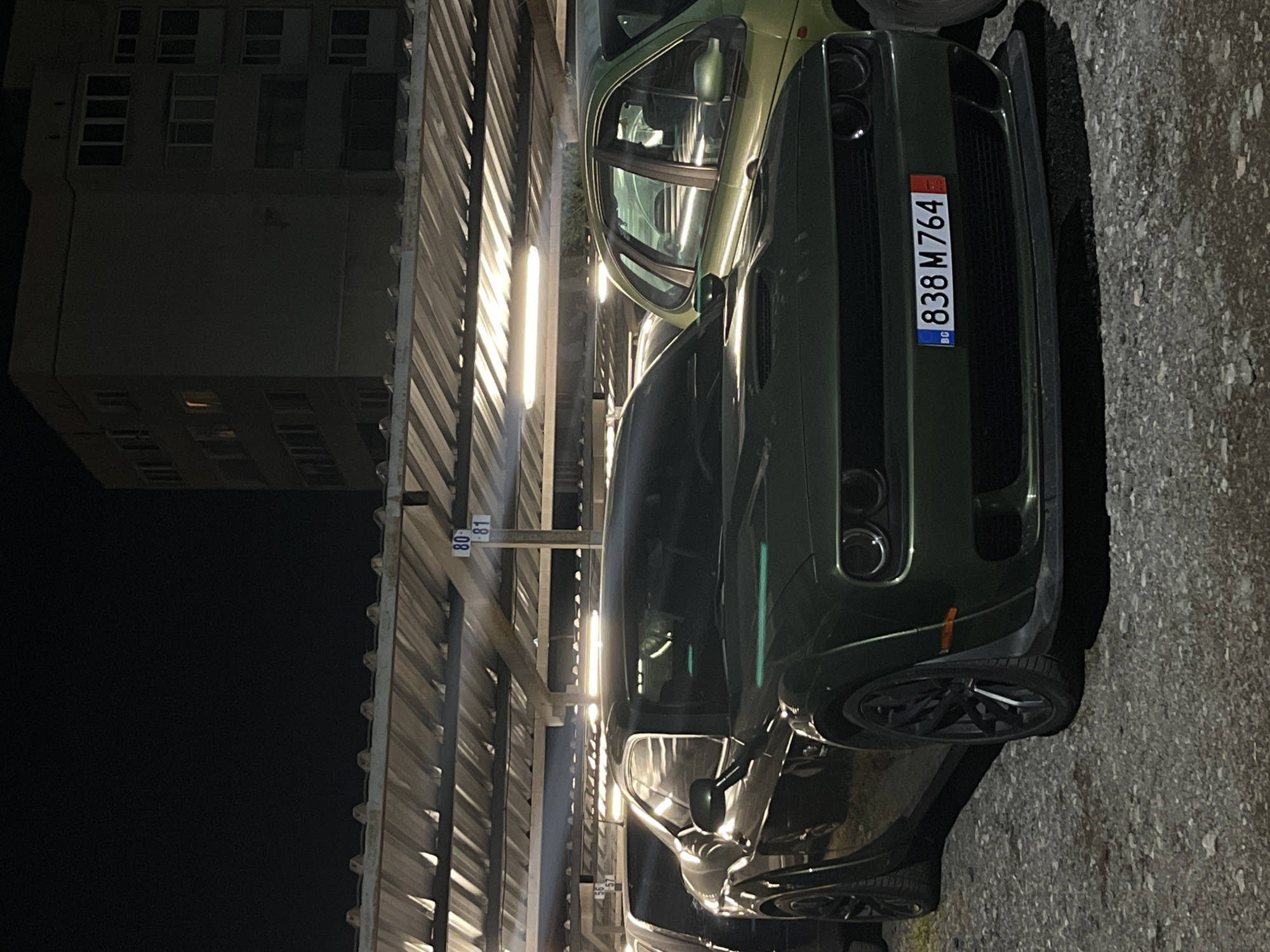 Green Dodge Challenger documented in Sofia parking garage