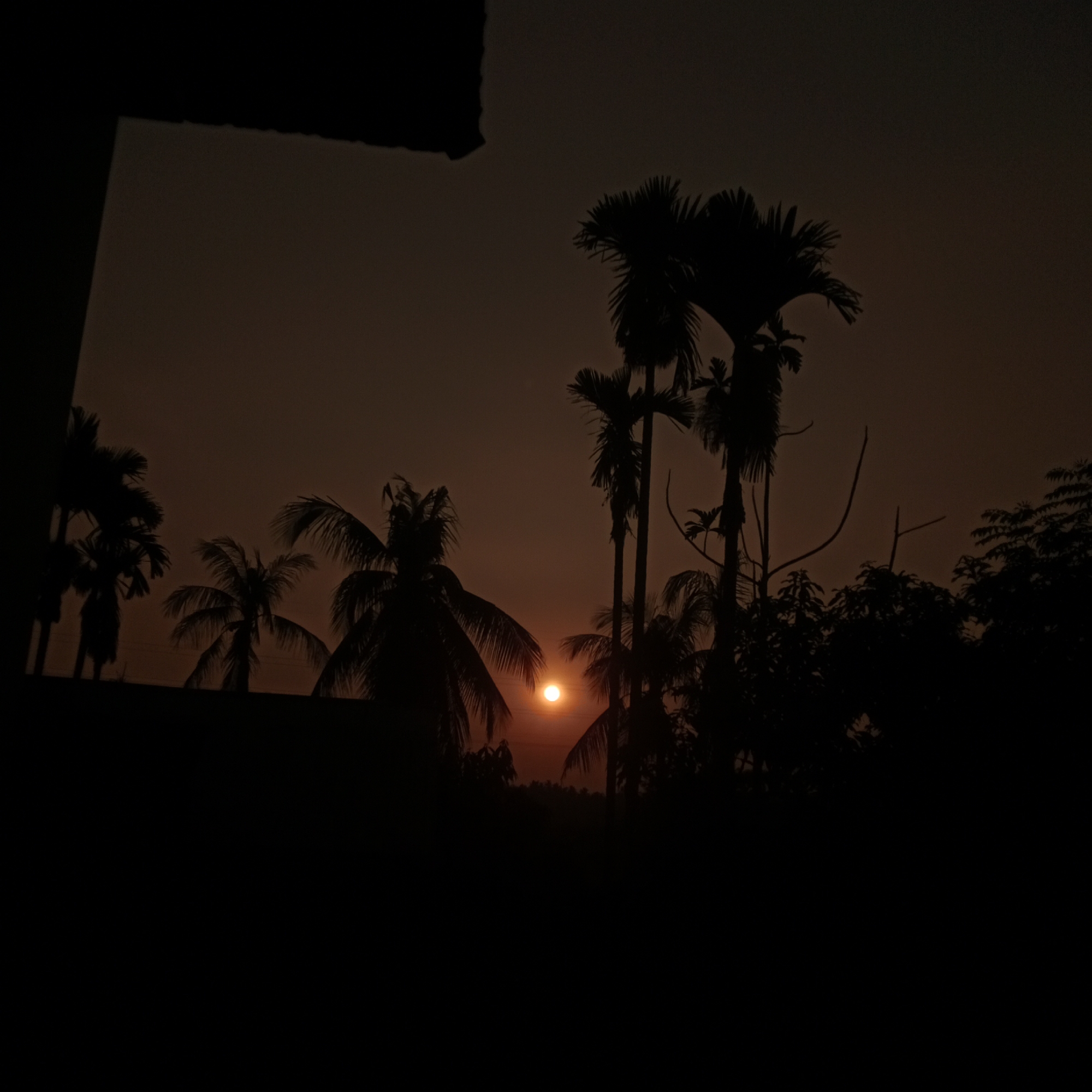 Lhokseumawe sunset fades into a tour bus night scene
