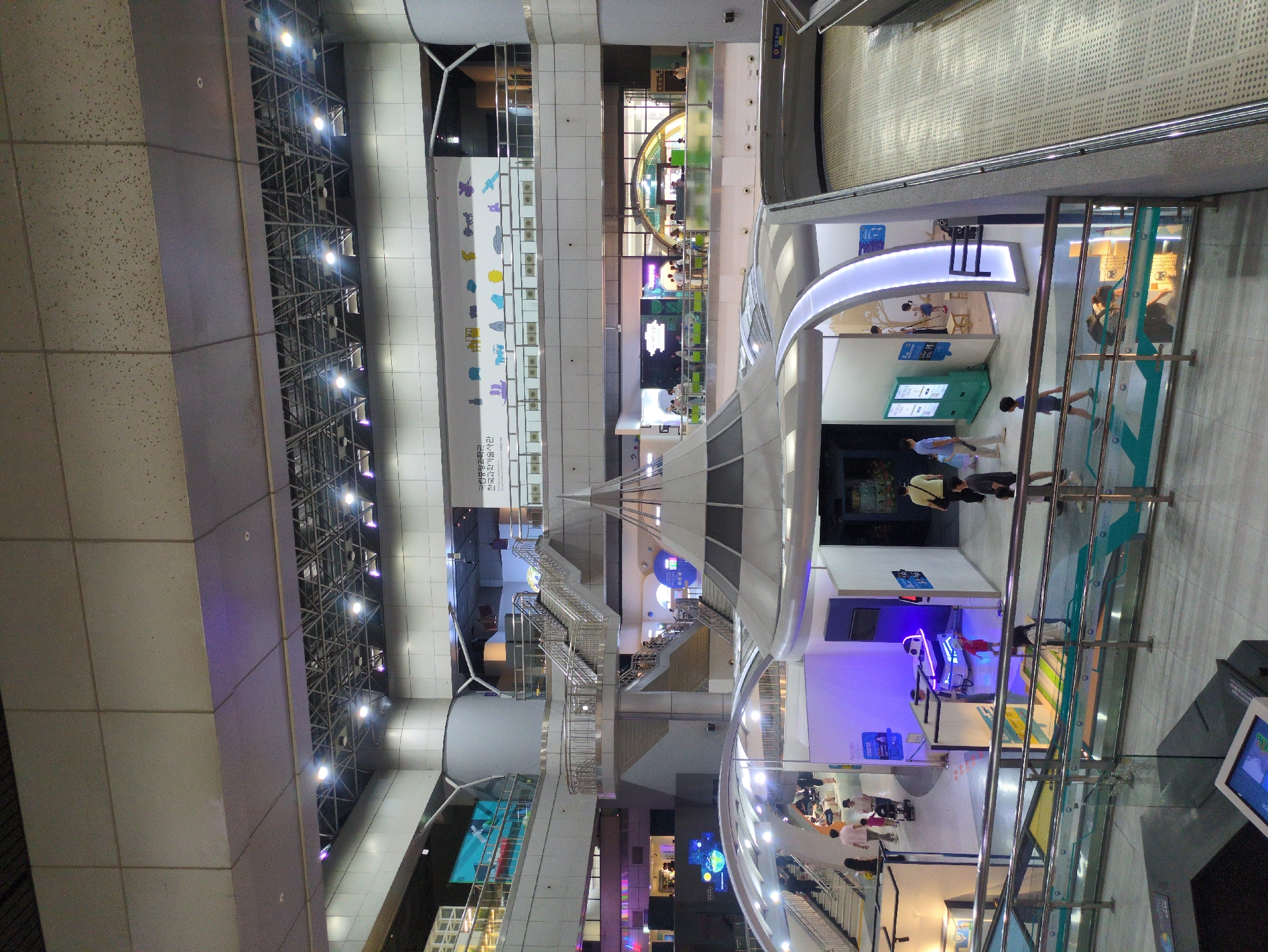Visitor documents science museum exhibits in Daejeon, South Korea