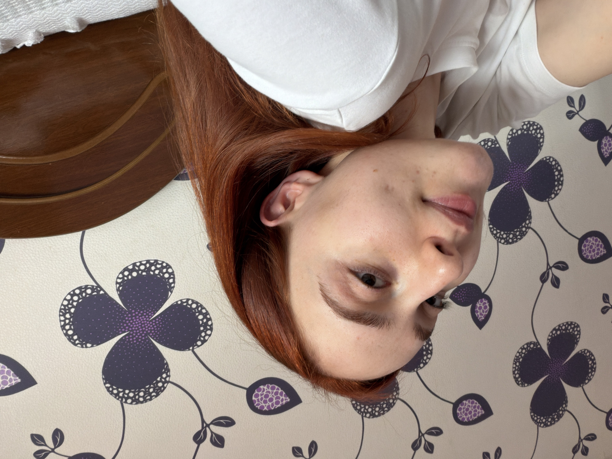 Person photographed in bedroom during morning hours in Tbilisi