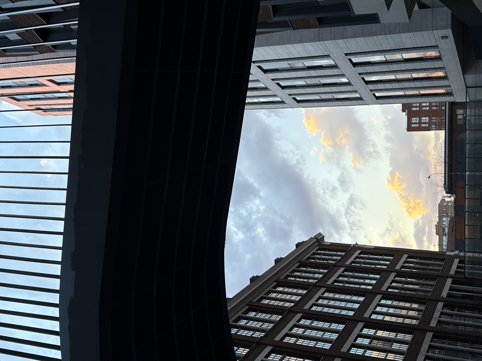 Moscow skyscrapers photographed against golden cloudy sky