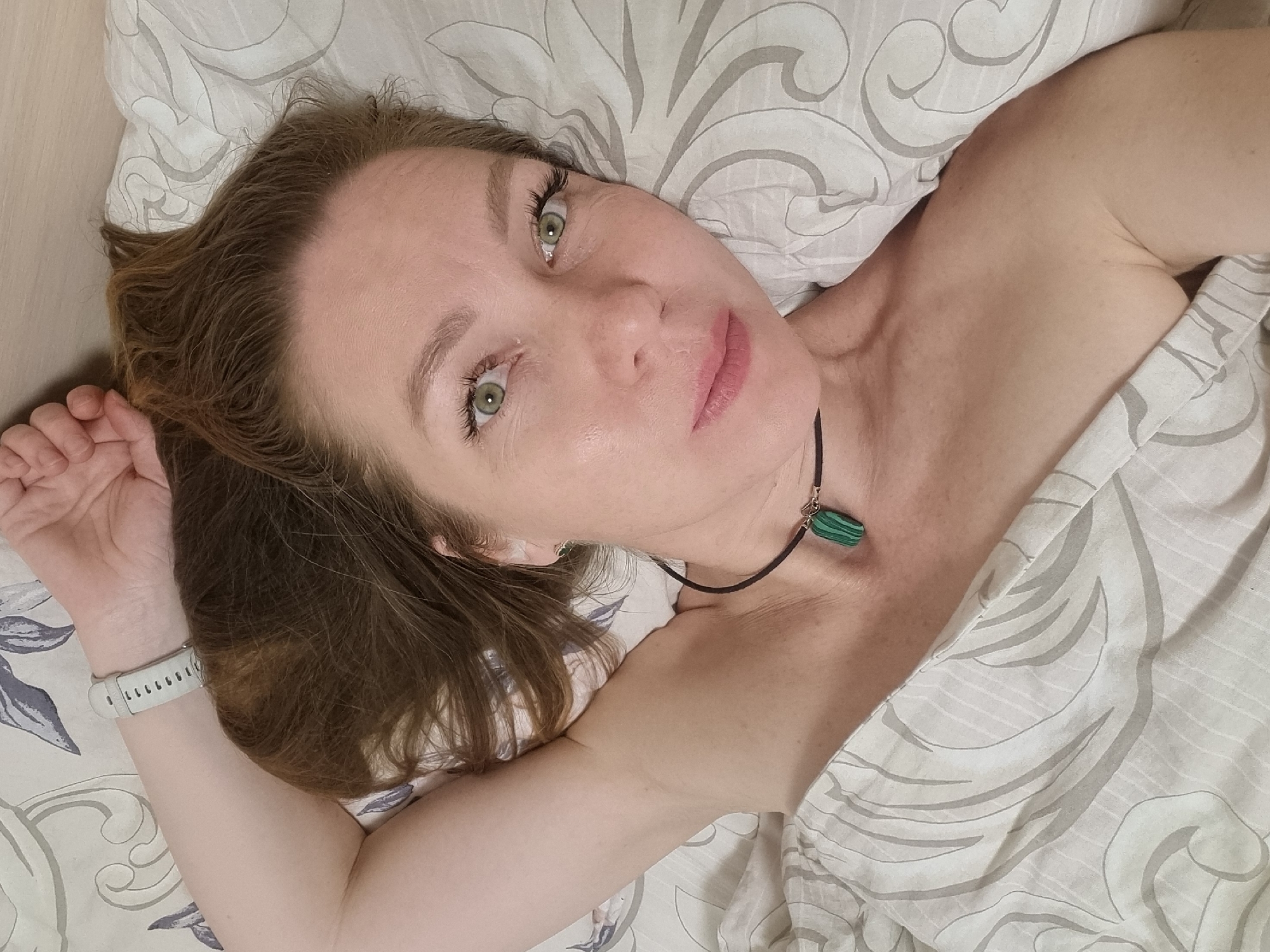 Woman and tabby cat share quiet evening moments in Chaikovsky